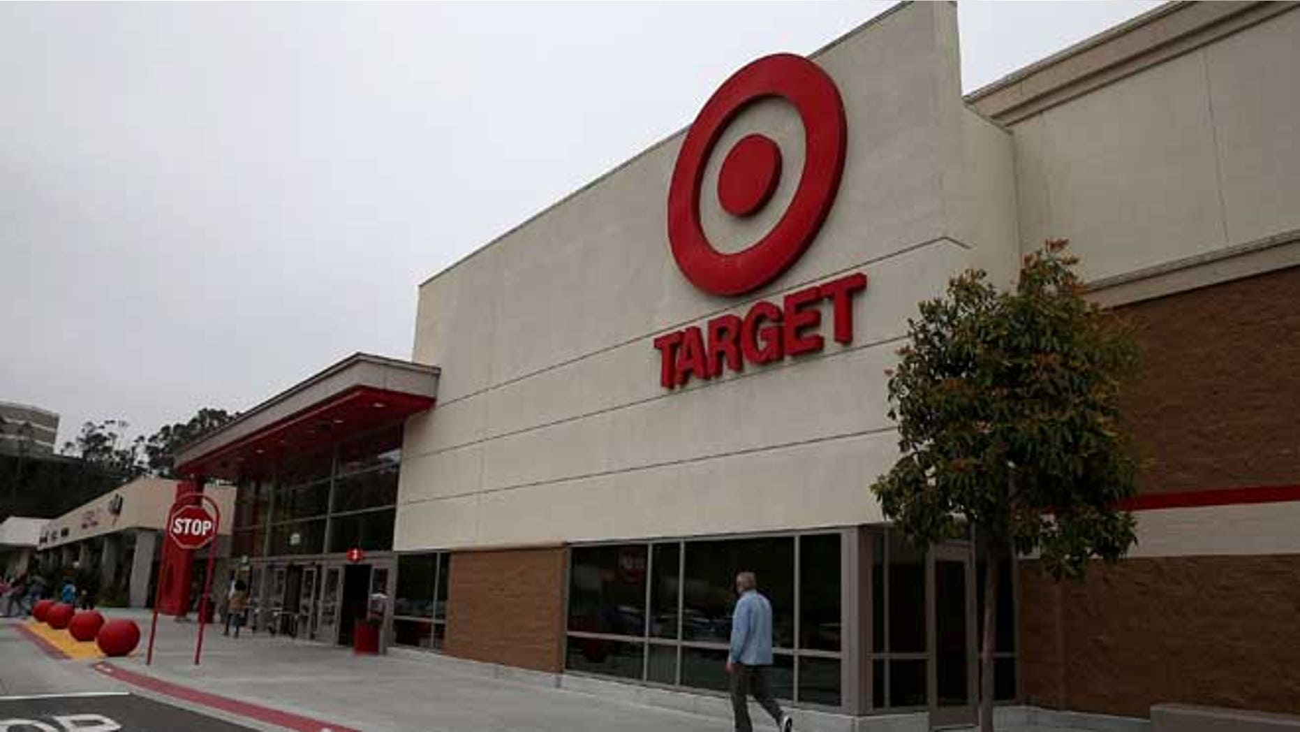 COLMA, CA - JUNE 15: A customer enters a Target store on June 15, 2015 in Colma, California. CVS Health announced that it has agreed to acquire Target's pharmacy and clinic businesses for an estimated $1.9 billion. (Photo by Justin Sullivan/Getty Images)