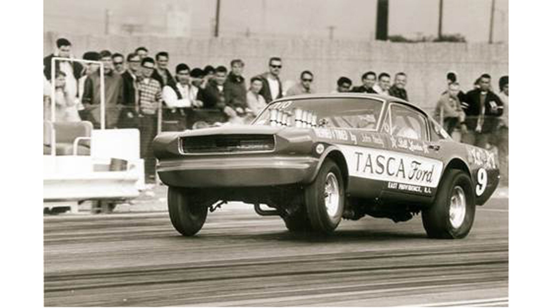 The Tasca Mystery 9 altered-wheelbase Mustang takes a bite of California’s Irwindale Raceway at the 1966 AHRA Winternationals with more than 600-hp worth of Hillborn-injected Ford 427 SOHC “cammer” V-8 authority.