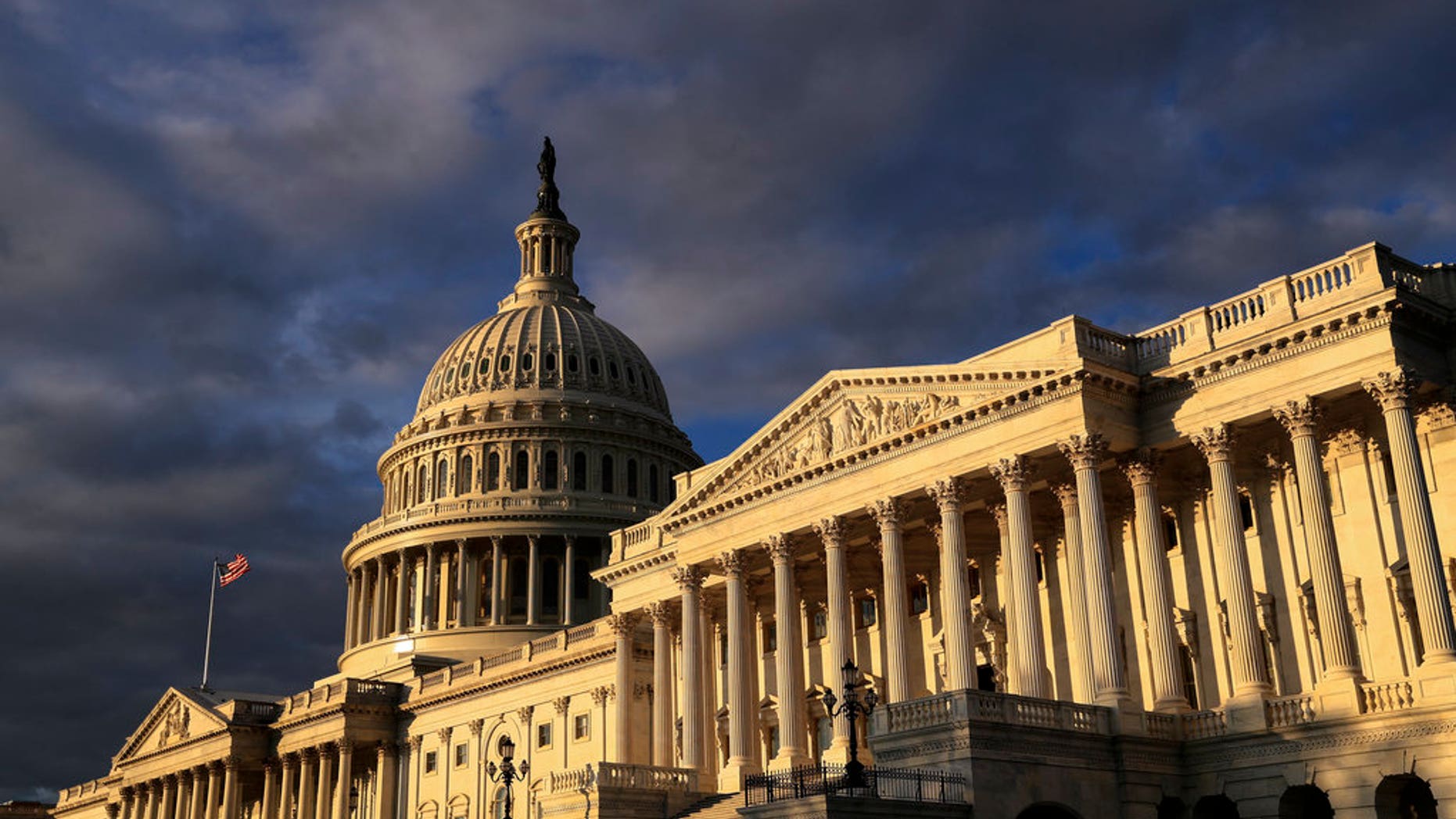 FILE - This Monday, Oct. 30, 2017, file photo shows the Capitol in Washington, at dawn. The House Republican tax plan would add $1.5 trillion to the federal debt at a time when the economy is doing pretty well on its own and the retirement of the Baby Boom generation is already putting a strain on Social Security and Medicare. All of which is why many analysts argue that big tax cuts arenât needed now, even if they would help stimulate the economy, which is far from certain. (AP Photo/J. Scott Applewhite, File)