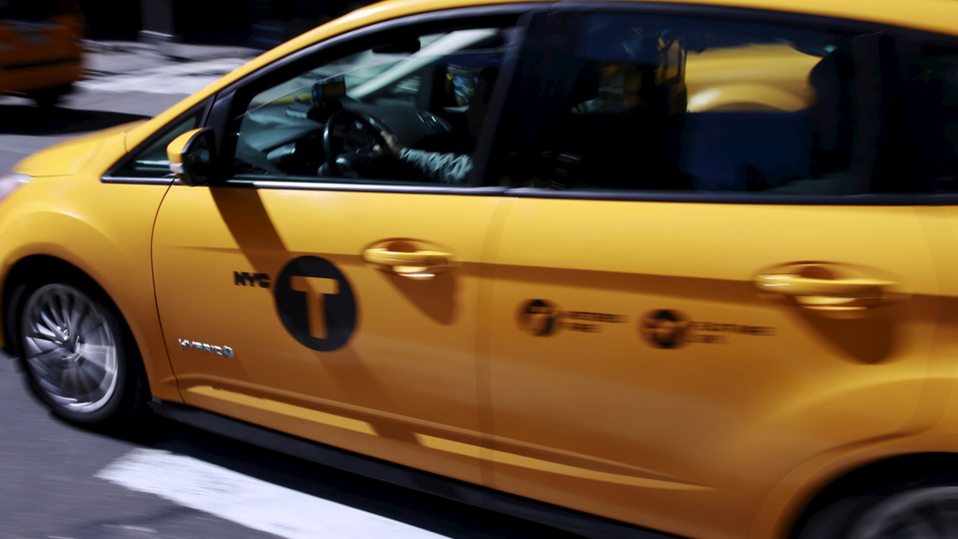 A tech company released a new app Thursday that will do for yellow taxis what Uber does for black cars — connecting riders with drivers and setting a price ahead of time. (REUTERS/Lucas Jackson)