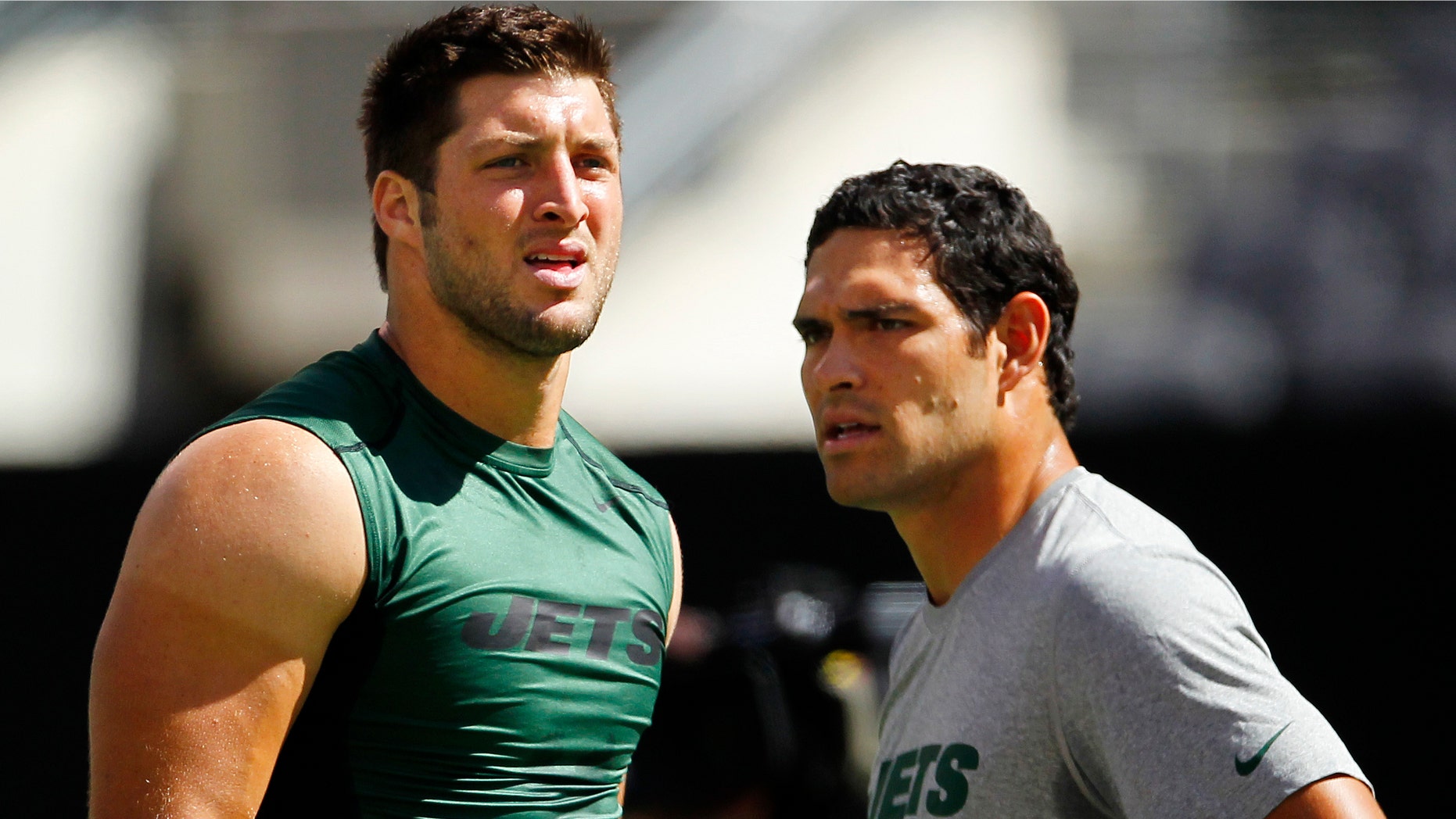 EAST RUTHERFORD, NJ - SEPTEMBER 9: Quarterbacks Tim Tebow #15 (L) and Mark Sanchez #6 of the New York Jets during pre-game warm ups before the start of their game against the Buffalo Bills at MetLife Stadium on September 9, 2012 in East Rutherford, New Jersey. (Photo by Rich Schultz /Getty Images)
