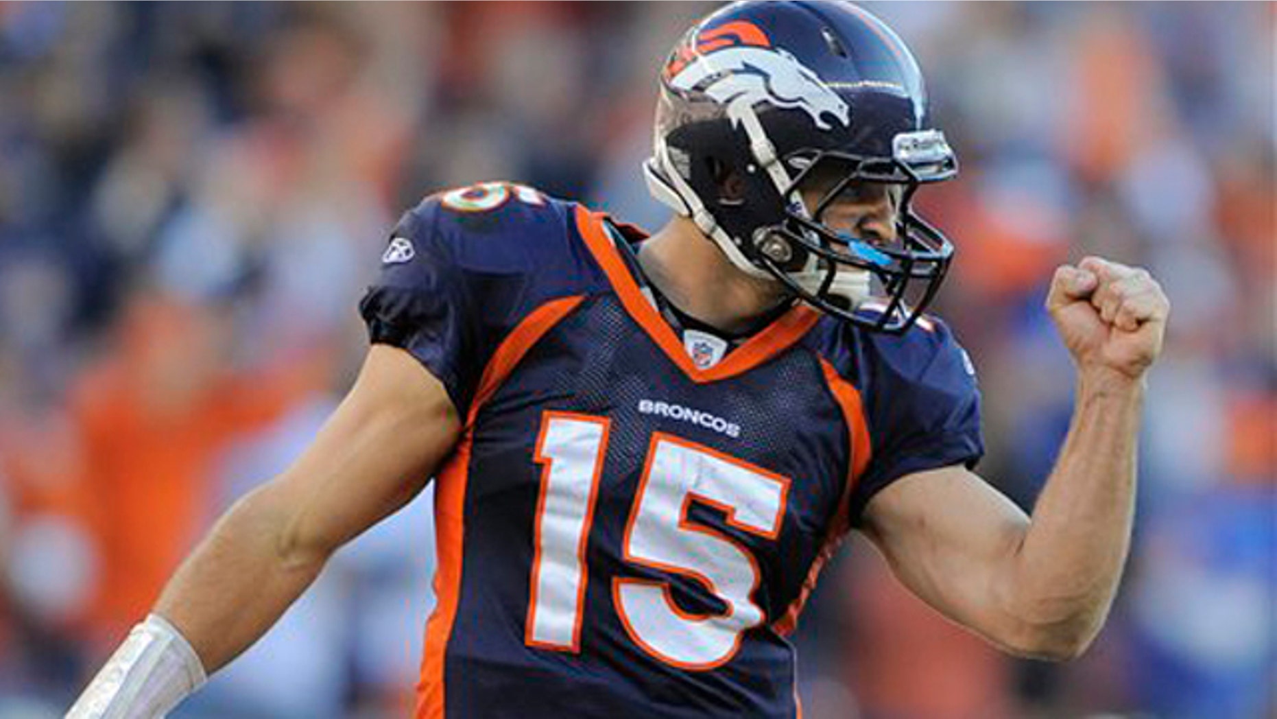 n this Dec. 18, 2011 file photo, Denver Broncos quarterback Tim Tebow (15) reacts after a touchdown run by Denver Broncos running back Lance Ball (35) against the New England Patriots, in Denver.