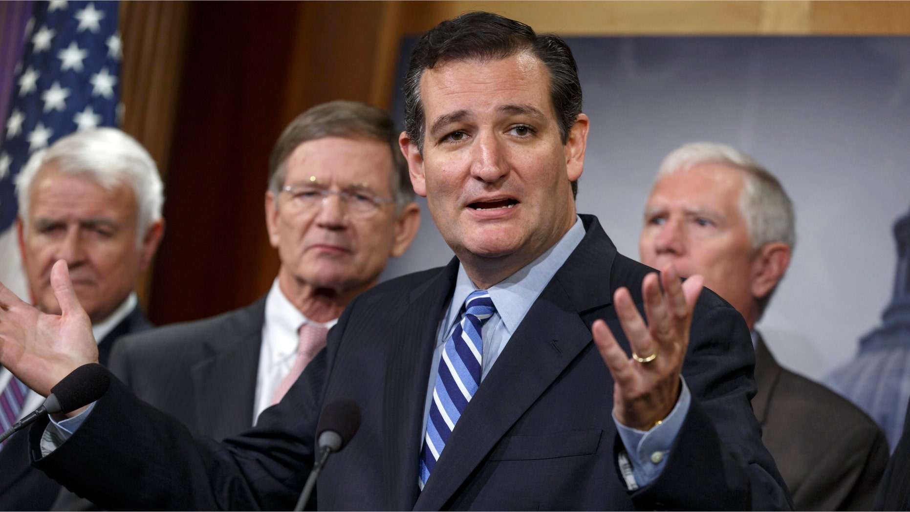 Sen. Ted Cruz, R-Texas, criticizes President Barack Obama, saying he has not taking a stand on the immigration crisis on the U.S.-Mexico border and is putting off executive action until after the politically-charged midterm election in November, Tuesday, Sept. 9, 2014, during a news conference on Capitol Hill in Washington. From left are, Rep. John Carter, R-Texas, Rep. Lamar S. Smith, R-Texas, Cruz, and Rep. Mo Brooks, R-Ala. Cruz said that the reason unaccompanied minors flooded the Southwest border during the summer is that they believe they will get amnesty and be allowed to stay in the United States. (AP Photo/J. Scott Applewhite)