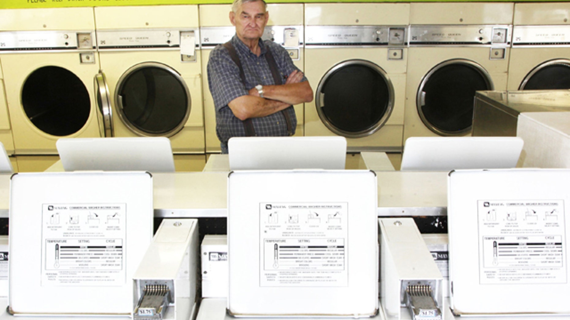 Aug. 10, 2012: Richard Eggars stands in a laundromat in Carlisle, Iowa that has come back to haunt him.