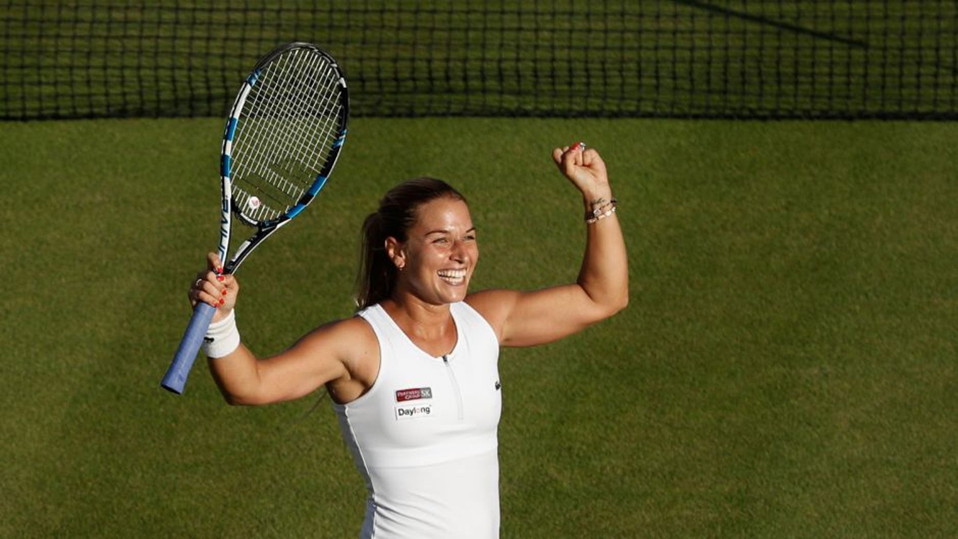 Slovakia's Dominika Cibulkova celebrates beating Canada's Eugenie Bouchard during their women's singles third round match on the sixth day of the 2016 Wimbledon Championships at The All England Lawn Tennis Club in Wimbledon, southwest London, on July 2, 2016. / AFP / ADRIAN DENNIS / RESTRICTED TO EDITORIAL USE (Photo credit should read ADRIAN DENNIS/AFP/Getty Images)