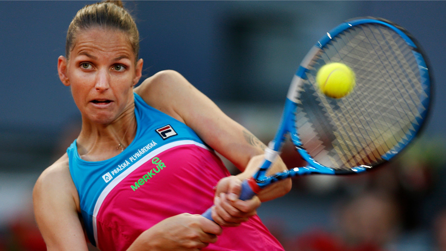 Karolina Pliskova from Czech Republic returns a ball from Czech Republic's Petra Kvitova during a Madrid Open tennis tournament semifinal match in Madrid, Spain
