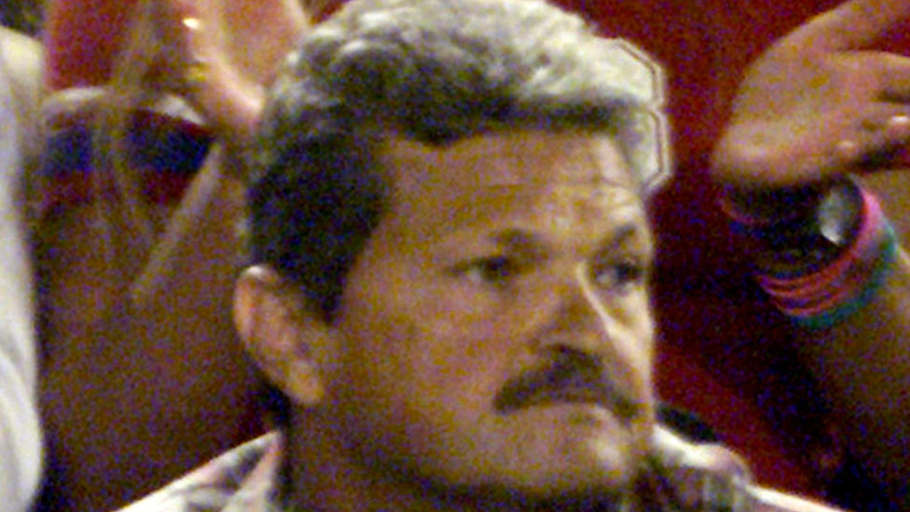 Nick Philippoussis, father of Australian tennis star Mark Philippoussis, watches his son play during the Australian Open in Melbourne, in an undated photo.