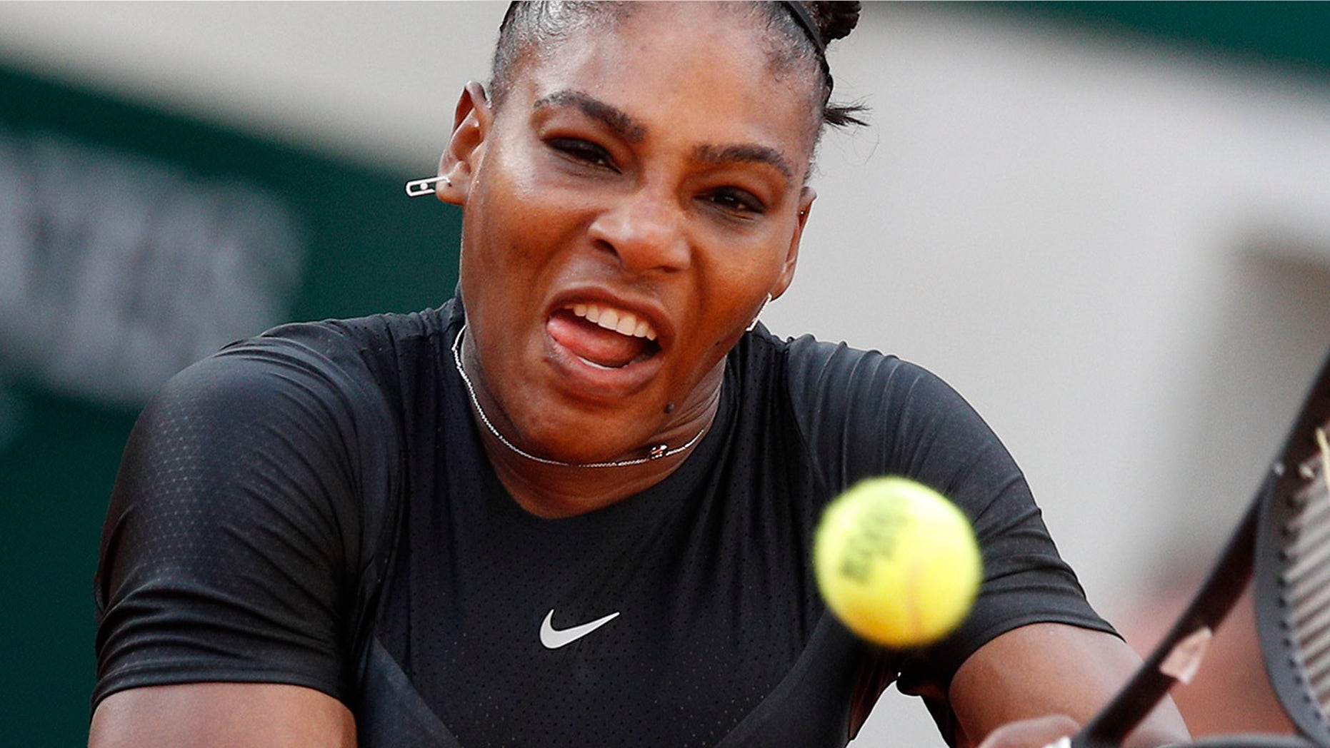 Serena Williams of the U.S. returns a shot against Germany's Julia Georges during their third round match of the French Open tennis tournament at the Roland Garros stadium in Paris.