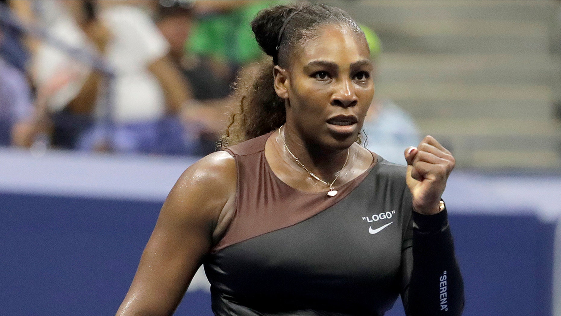 Serena Williams reacts after a point against Magda Linette, of Poland, during the first round of the U.S. Open tennis tournament