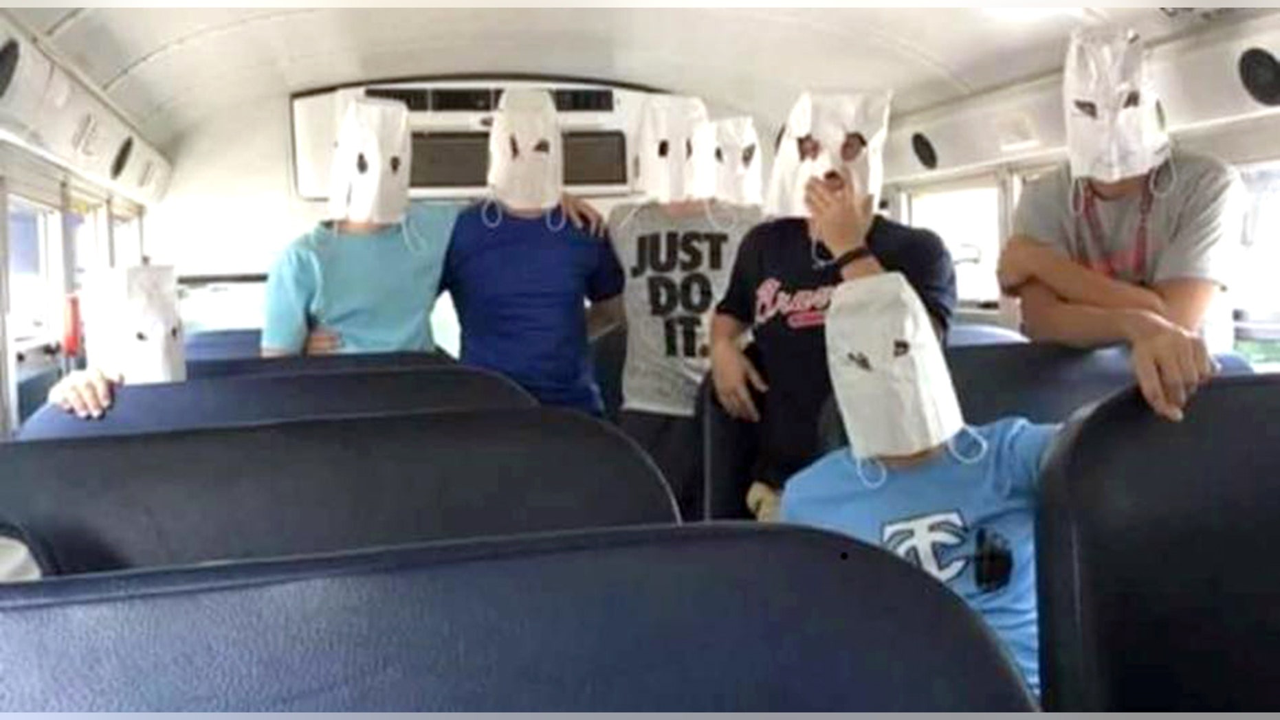 Tennis players from Teflair County High School in McRae, GA posed with white bags that look like KKK hoods after losing to a team with black members.