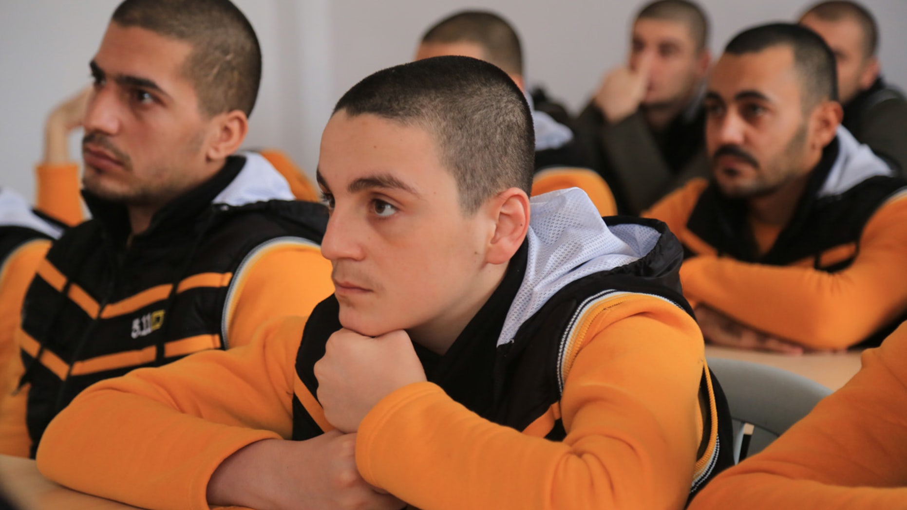 Participants watch their instructor at the Syrian Center for Anti-Extremist Ideology