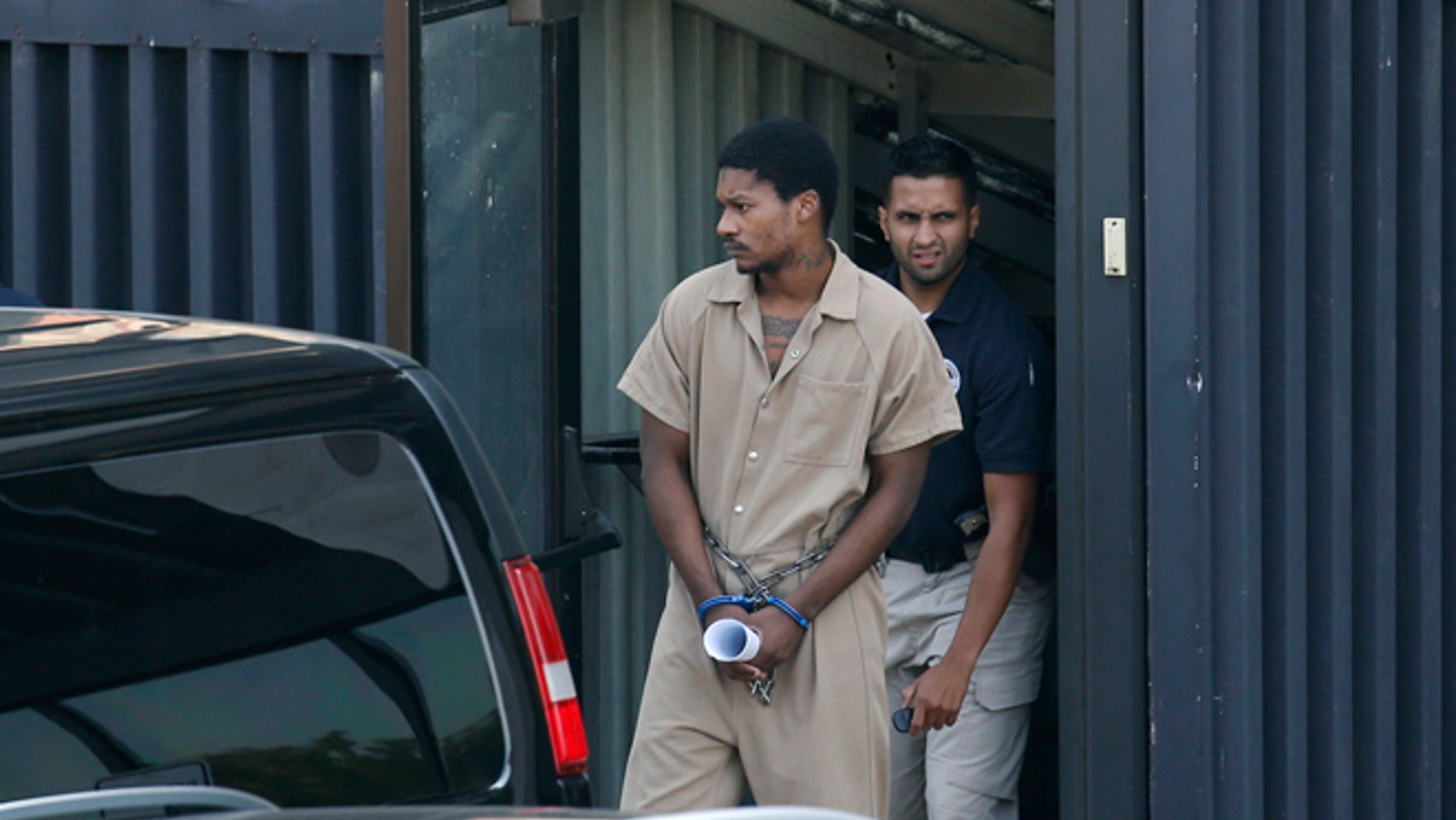 Emanuel Lutchman is transported out of a Federal Building on Thursday, Aug. 11, 2016, in Rochester, N.Y. Lutchman pleaded guilty Thursday to conspiracy to support the Islamic State.