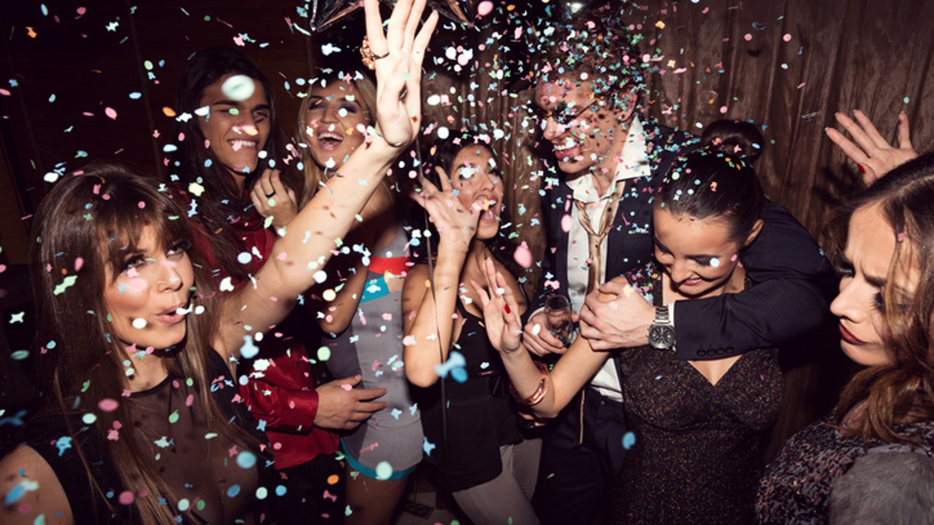 Group of friends dancing and enjoying a night out in the club.