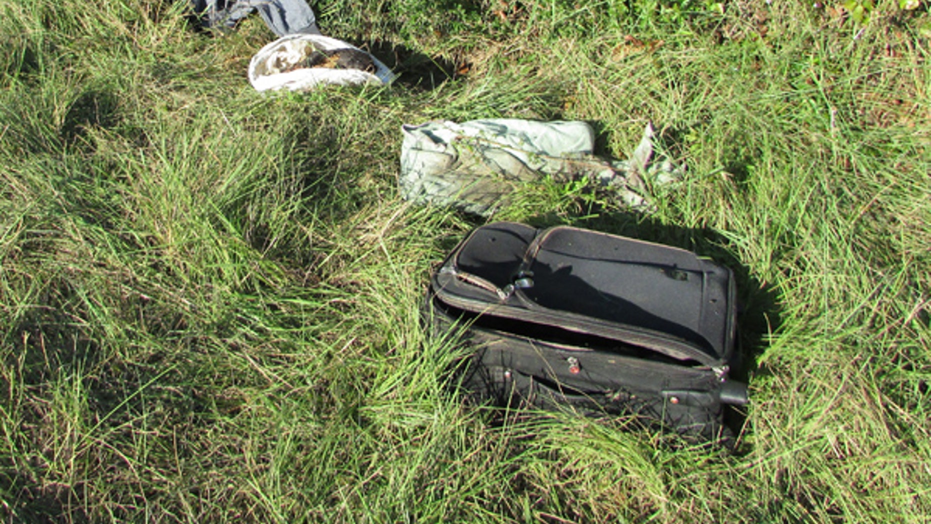 Sept. 17, 2016: A child's remains are found inside this suitcase, near the southbound lane of Interstate 45 and some seven miles north of Madisonville, Texas.