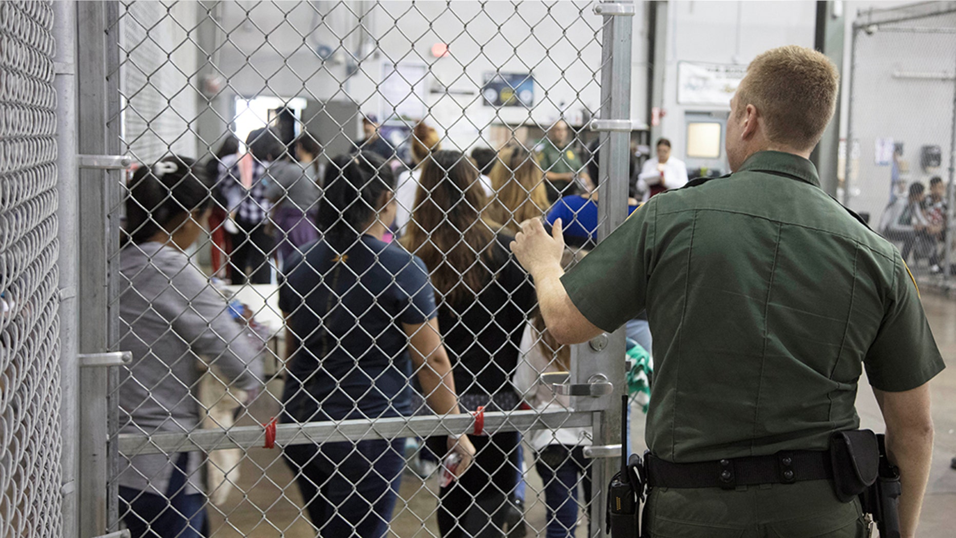 A view of inside U.S. Customs and Border Protection (CBP) detention facility shows detainees inside fenced areas at Rio Grande Valley Centralized Processing Center in Rio Grande City, Texas, U.S., June 17, 2018. Picture taken on June 17, 2018. Courtesy CBP/Handout via REUTERS ATTENTION EDITORS - THIS IMAGE HAS BEEN SUPPLIED BY A THIRD PARTY. - RC1E987A5800