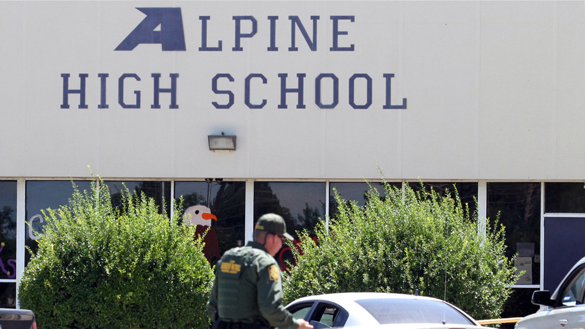 Sept. 8, 2016: A United States Border Patrol officer patrols the perimeter at Alpine High School after a shooting in Alpine, Texas.