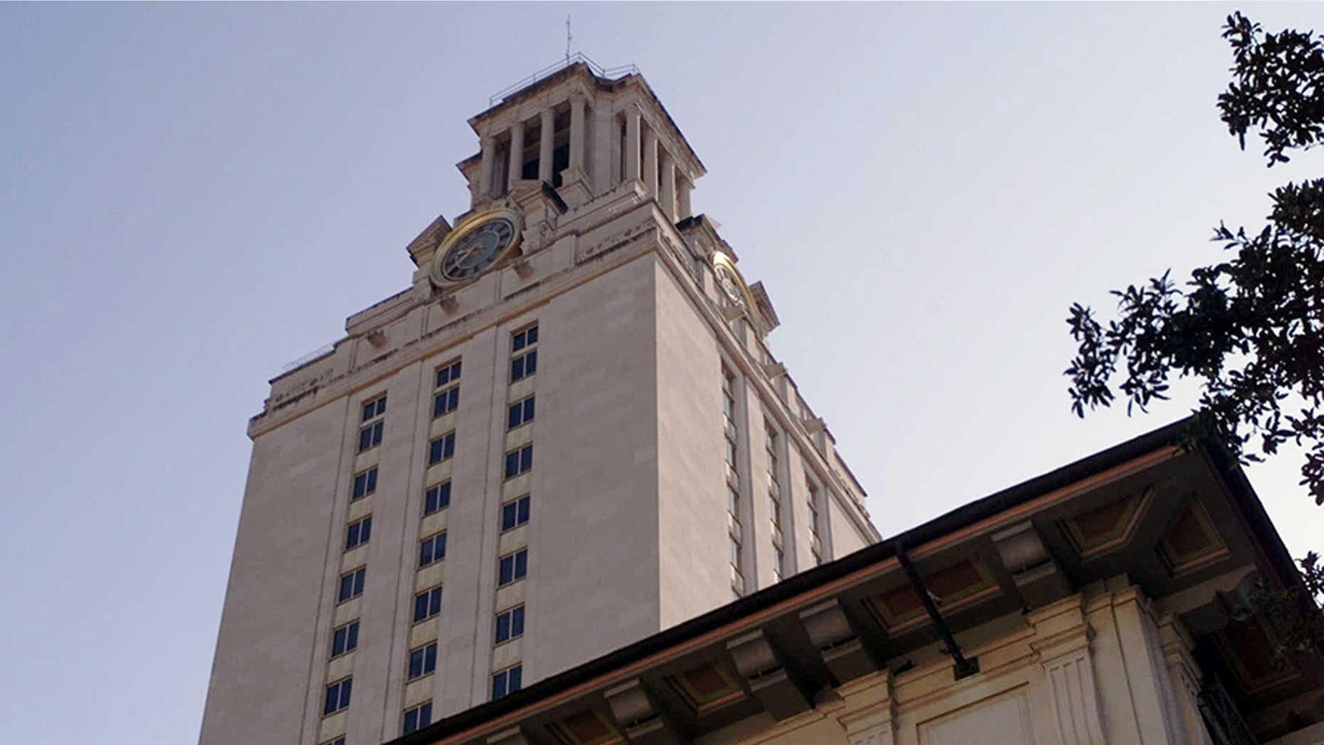 The Main Bell Tower at the University of Texas is shown Wednesday, Sept. 15, 1999, in Austin, Texas. Reopening of the observation deck, located just below the clock face, is a part of the university's 116th birthday celebration. The deck was closed to the public in 1974 after several suicides. It was the position taken by a sniper in 1966 who killed 14 and wounded 31 people. The protective stainless steel lattice curtain that arches above the deck is a recent addition. (AP Photo/Harry Cabluck)
