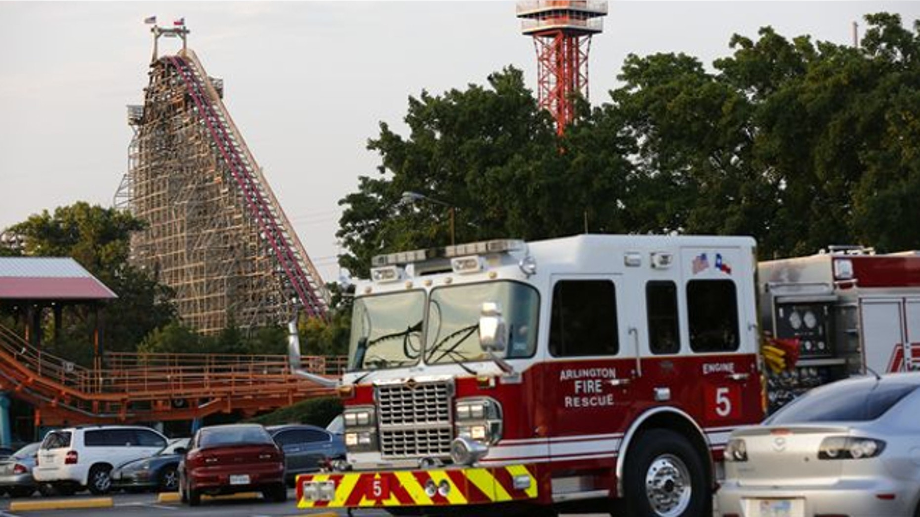 July 19, 2013: Emergency personnel are on the scene at Six Flags Over Texas in Arlington, Texas, after a woman died on the Texas Giant roller coaster.