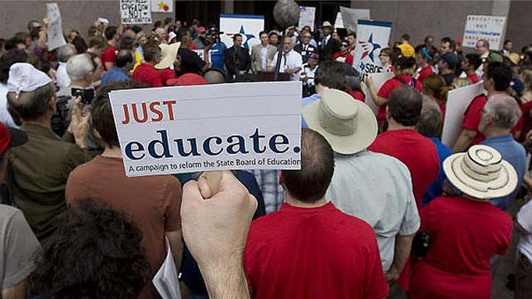 Several hundred protestors gather in Austin outside the building where the Texas State Board of Education met in May regarding controversial revisions to social studies textbooks.