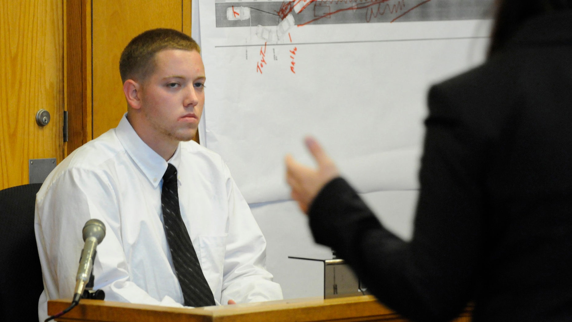 June 5, 2012: Defendant Aaron Deveau, 18, listens to assistant district attorney Ashlee Logan while testifying at Haverhill District Court in Haverhill, Mass.