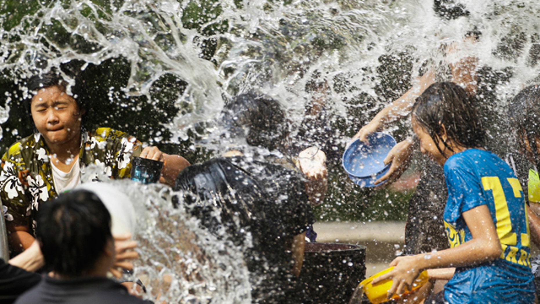 April 15: Thais splash water each other during New Year celebrations in Bangkok, Thailand. (AP)
