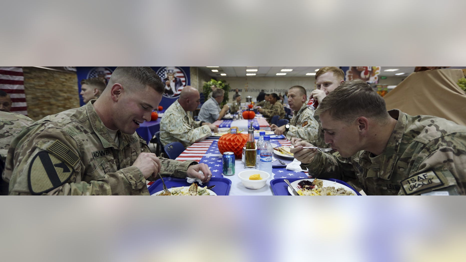 NATO soldiers have their Thanksgiving Day meals at the ISAF headquarters in Kabul, Afghanistan, Thursday, Nov. 27, 2014. This is the last Thanksgiving cerebration before the U.S. and NATO combat mission ends on Dec. 31 this year. (AP Photo/Rahmat Gul)
