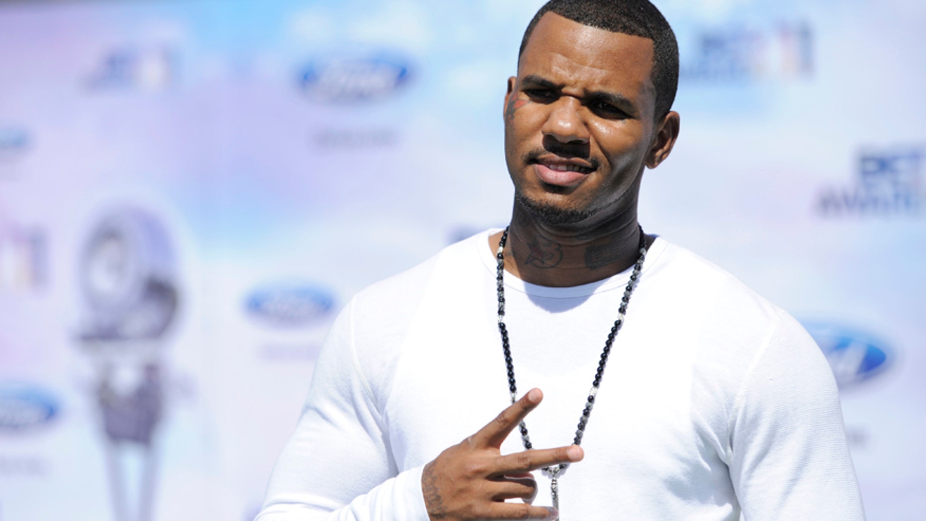 FILE - In this June 26, 2011, file photo, Jayceon Terrell Taylor, also known as The Game, arrives at the BET Awards in Los Angeles. The rapper has been arrested Monday, June 8, 2015, in connection with a violent incident involving an off-duty police officer at a pickup basketball game in March. (AP Photo/Chris Pizzello, File)