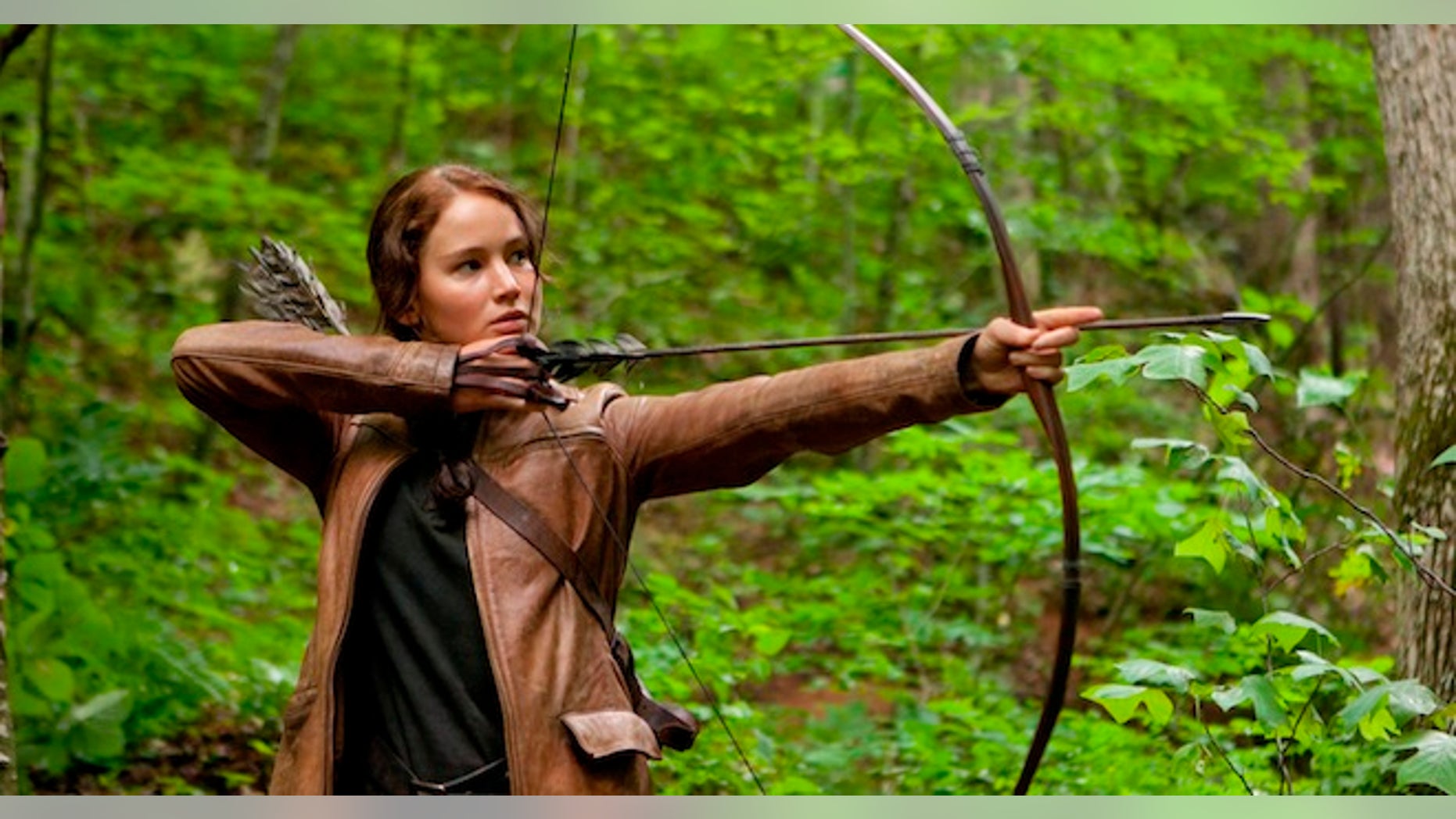 FILE - In this image released by Lionsgate, Jennifer Lawrence portrays Katniss Everdeen in a scene from "The Hunger Games," opening on Friday, March 23, 2012. Lionsgate announced today that "The Hunger Games: Mockingjay," Part 1 will be released on November 21, 2014, and Part 2, will be released on November 20, 2015. (AP Photo/Lionsgate, Murray Close, File)
