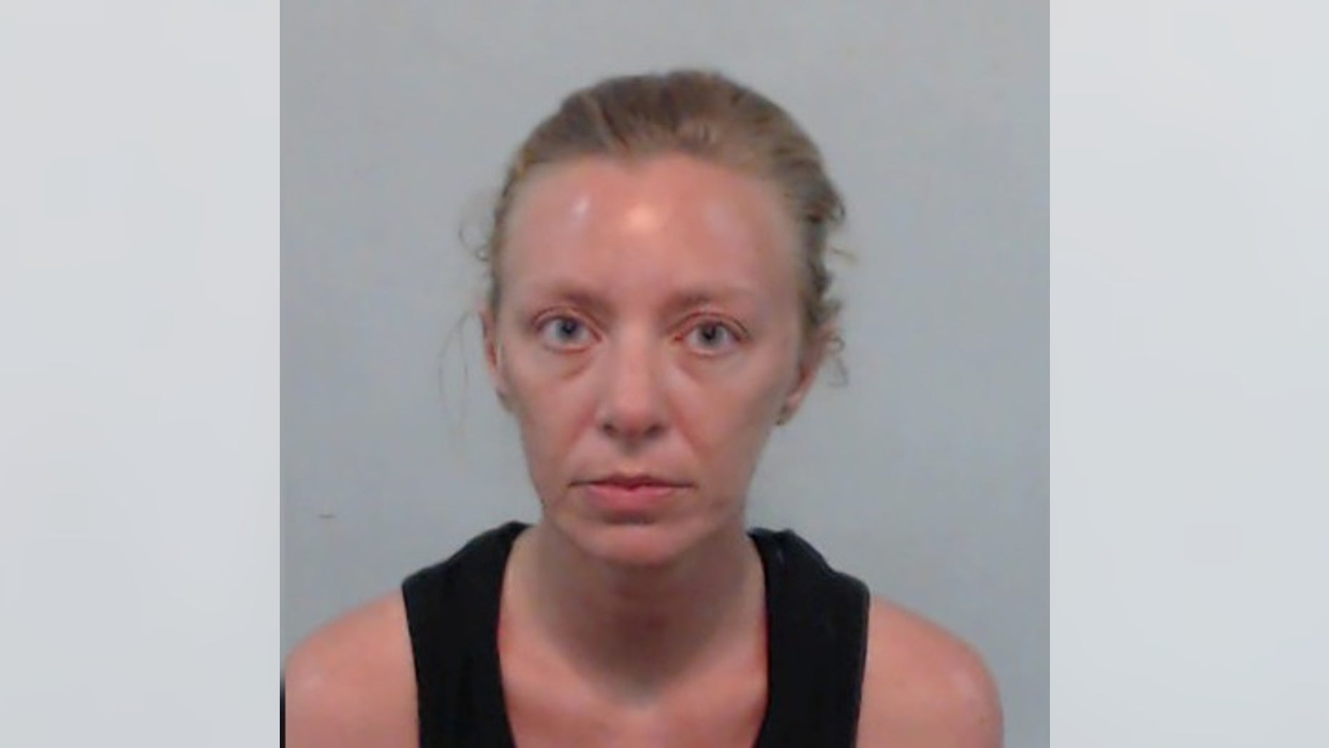Kimberly Dunn, 35, was accused of shooting her estranged husband in the testicles after he tried to take an air conditioner from her.