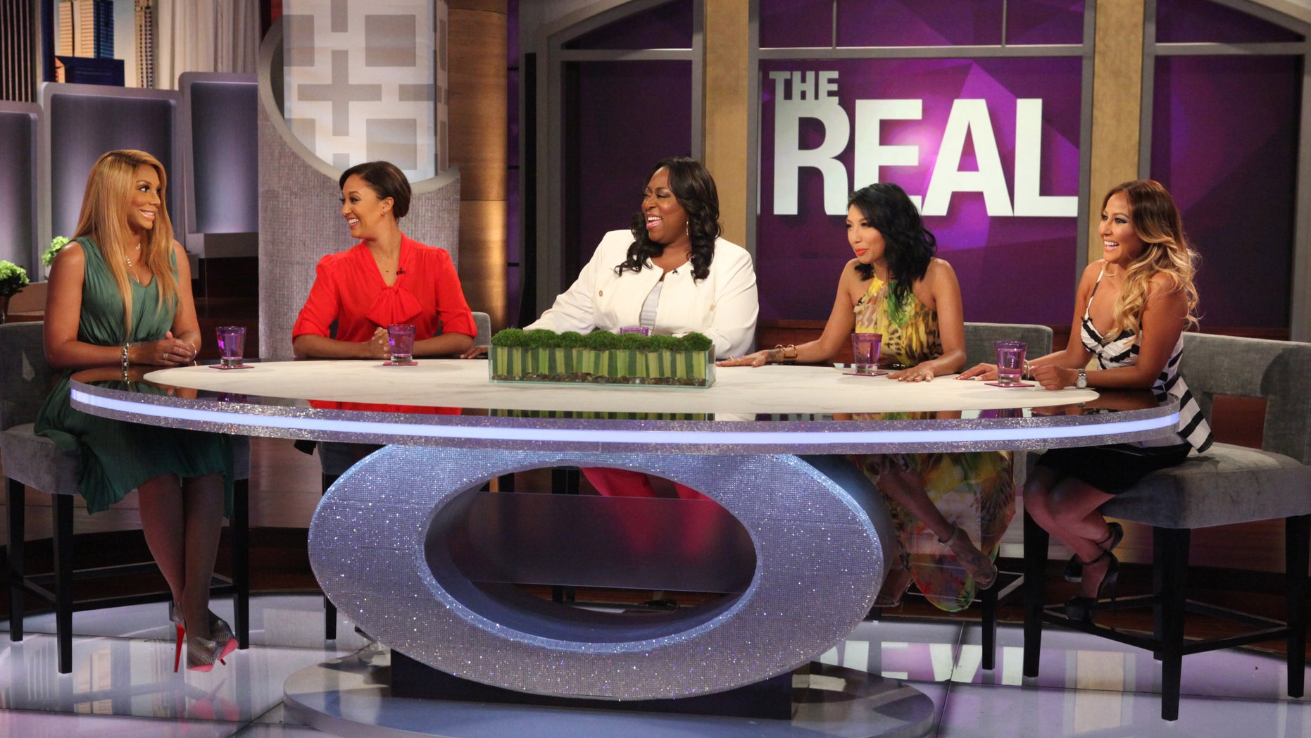 Hosts of "The Real" (From Left to Right: Tamar Braxton, Tamera Mowry-Housley, Loni Love, Jeannie Mai and Adrienne Bailon) on set.