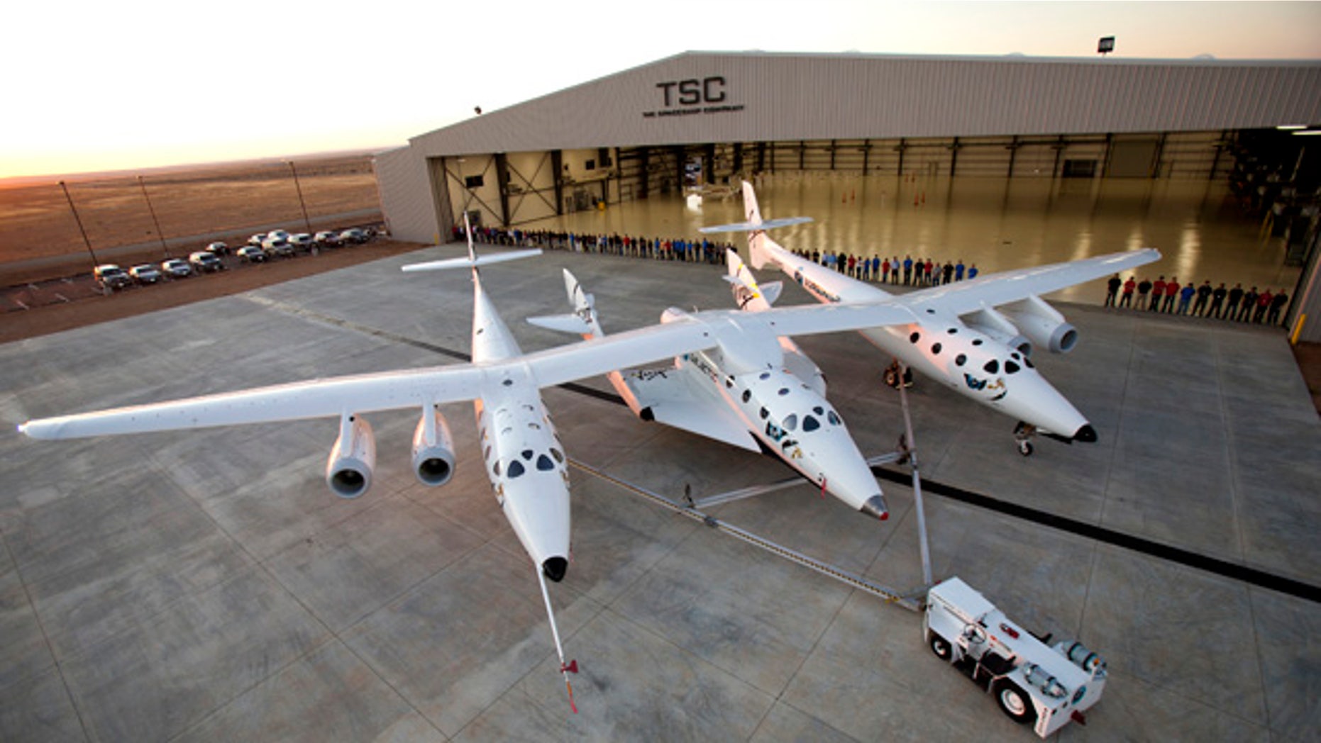 Sept. 19, 2011: More than 80 employees of The SpaceShip Company gather for a group photo at their new hangar facility, FAITH (final assembly integration test hangar), at the Mojave Air and Space Port in Mojave, CA.