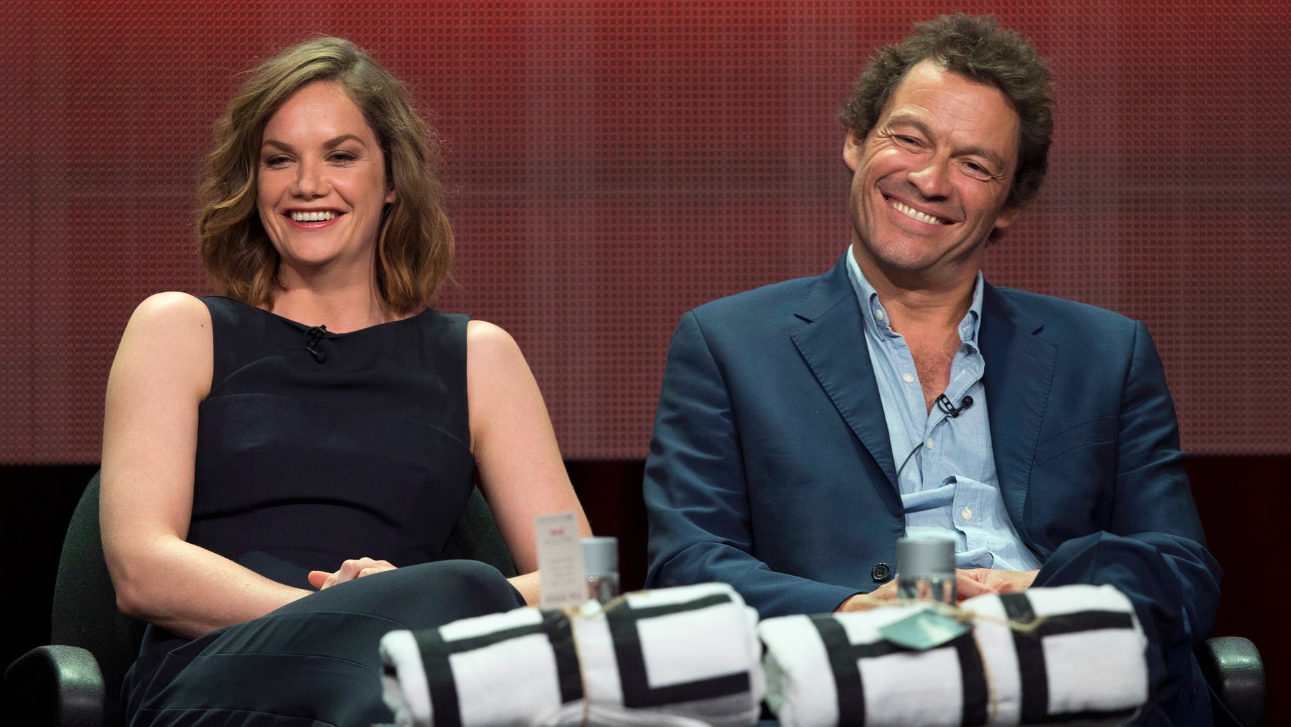 Cast members Ruth Wilson and Dominic West smile at a panel for the Showtime television series "The Affair" during the Television Critics Association Cable Summer Press Tour in Beverly Hills, California July 18, 2014. REUTERS/Mario Anzuoni