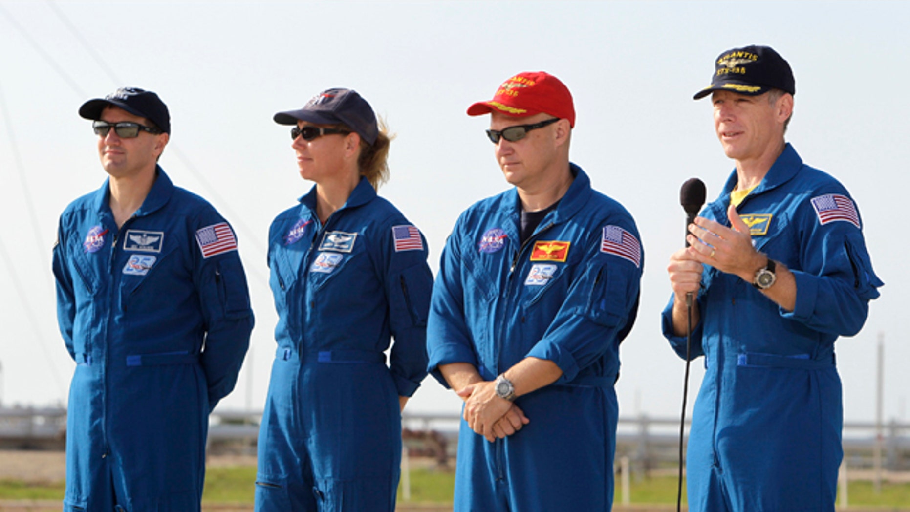 The crew of space shuttle Atlantis, from left, mission specialist Rex Walhiem, mission specialist Sandy Magnus, pilot Doug Hurley and commander Chris Ferguson attend a news conference at Pad 39A during the Terminal Countdown Demonstration Test at the Kennedy Space Center in Cape Canaveral, Fla., Wednesday, June 22, 2011.