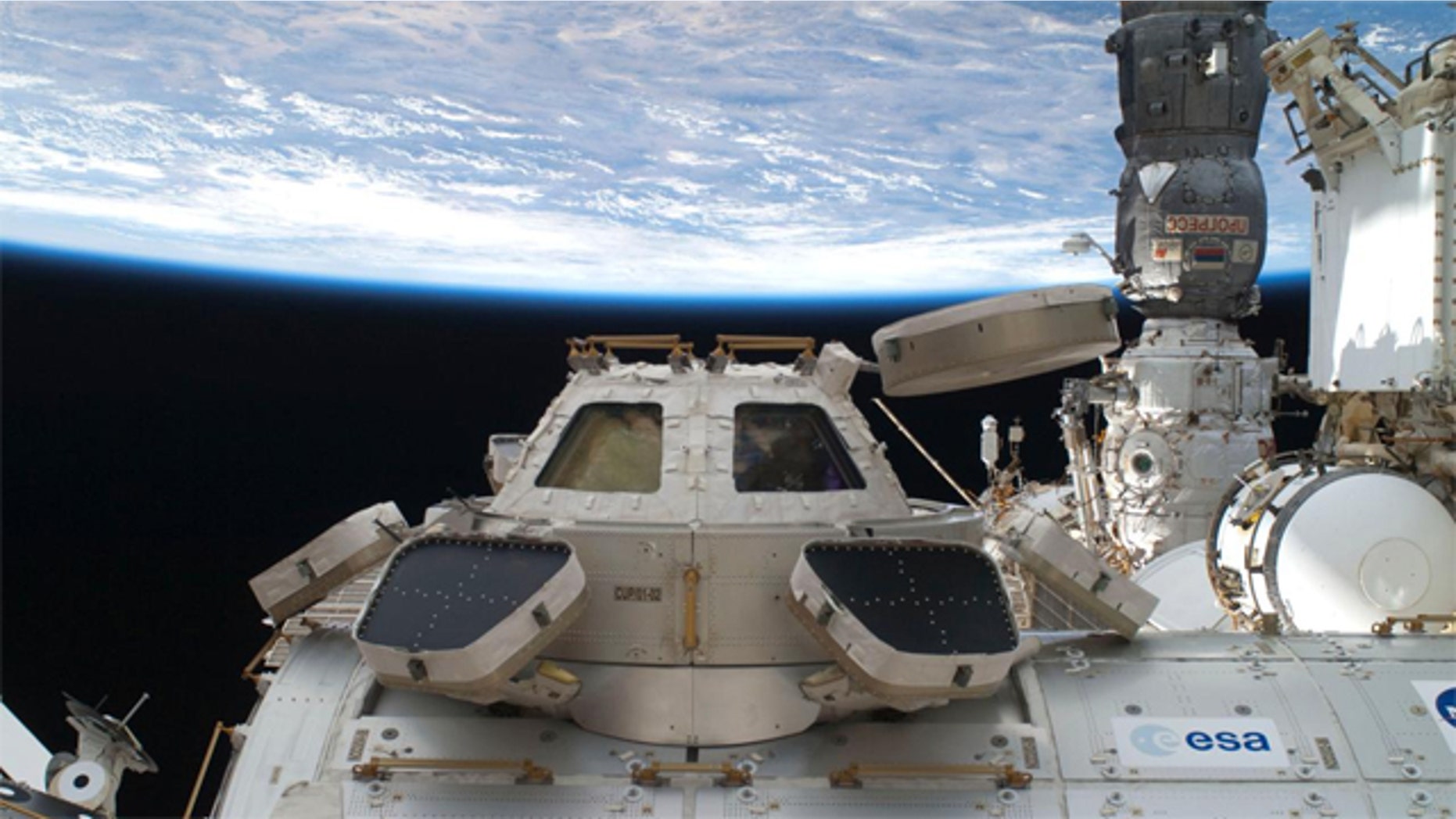The astronauts making NASA's last shuttle flight turned into moving men and garbage haulers Wednesday July 13, 2011 with no time to dwell on their place in space history, after enjoying a special salute from the original "Rocket Man," Elton John.