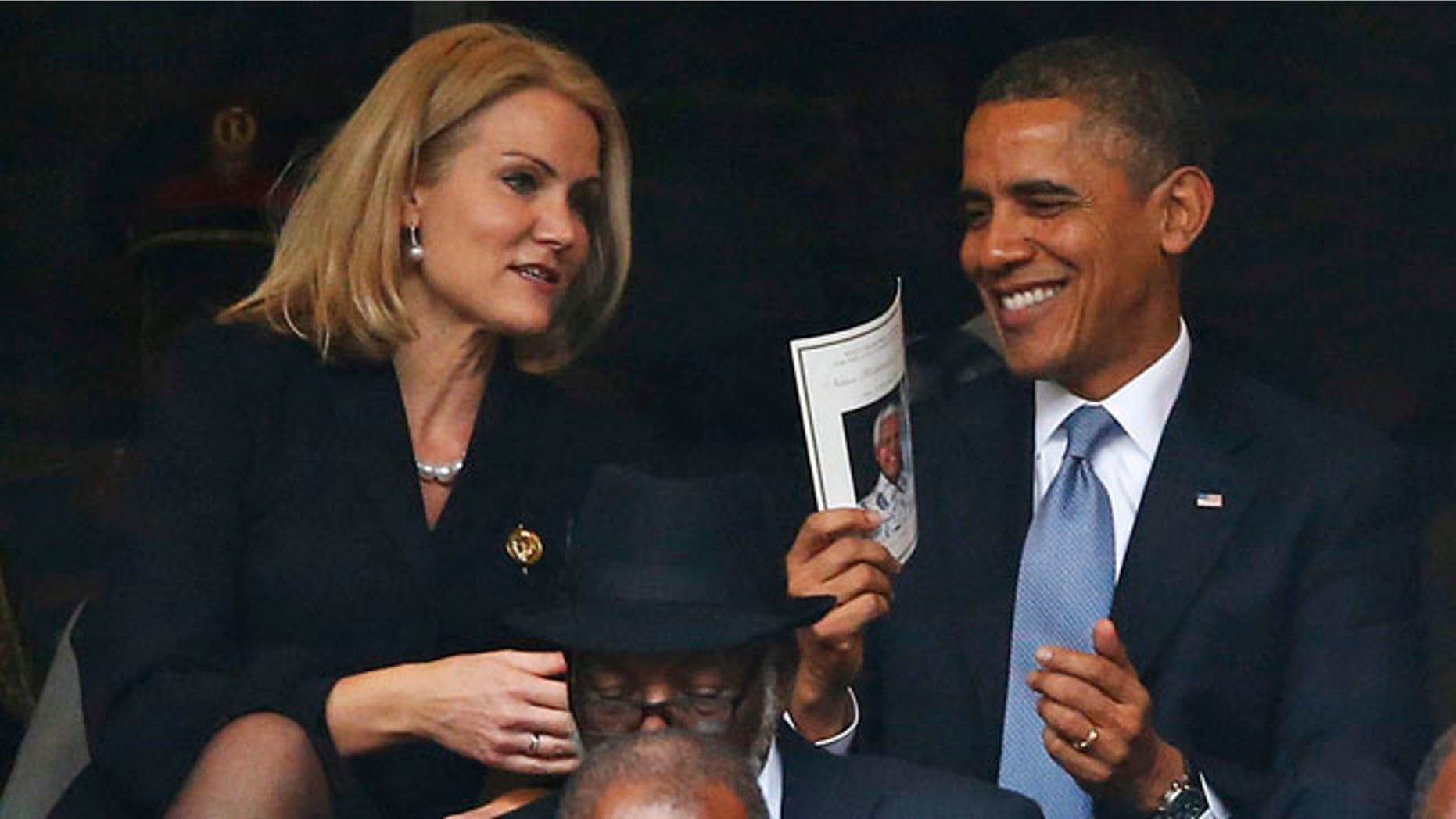 Dec. 10, 2013: President Barack Obama laughs with Danish prime minister, Helle Thorning-Schmidt, during the memorial service for former South African president Nelson Mandela at the FNB Stadium in Soweto, near Johannesburg, South Africa.