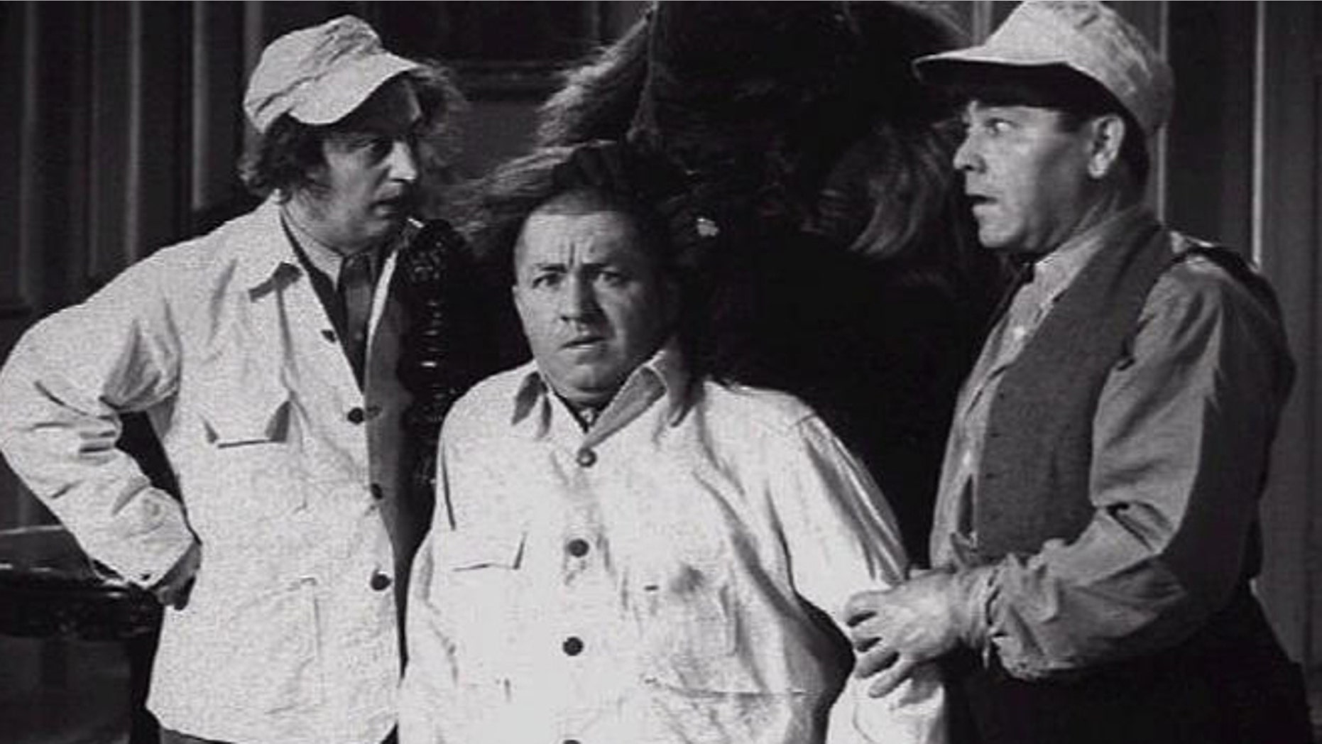 Larry Fine, Curly Jo De Rita, and Moe Howard in a scene from The Three Stooges movie.