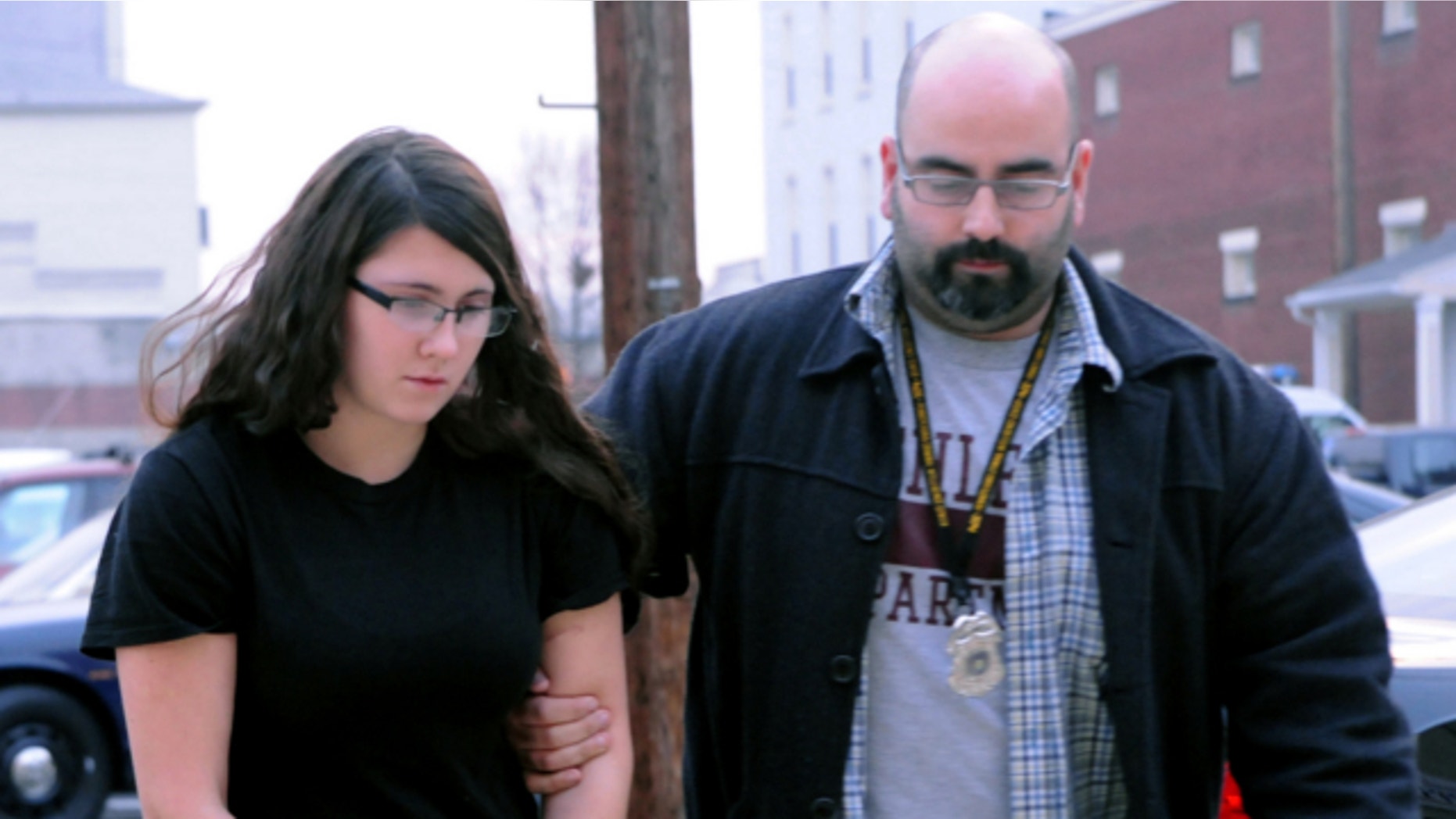 Dec. 3, 2013: Miranda K. Barbour is led into District Judge Ben Apfelbaum's office in Sunbury, Pa., by Sunbury policeman Travis Bremigen. Barbour is charged in the murder of Troy LaFerrara, whose body was found in a backyard in Sunbury, in November.