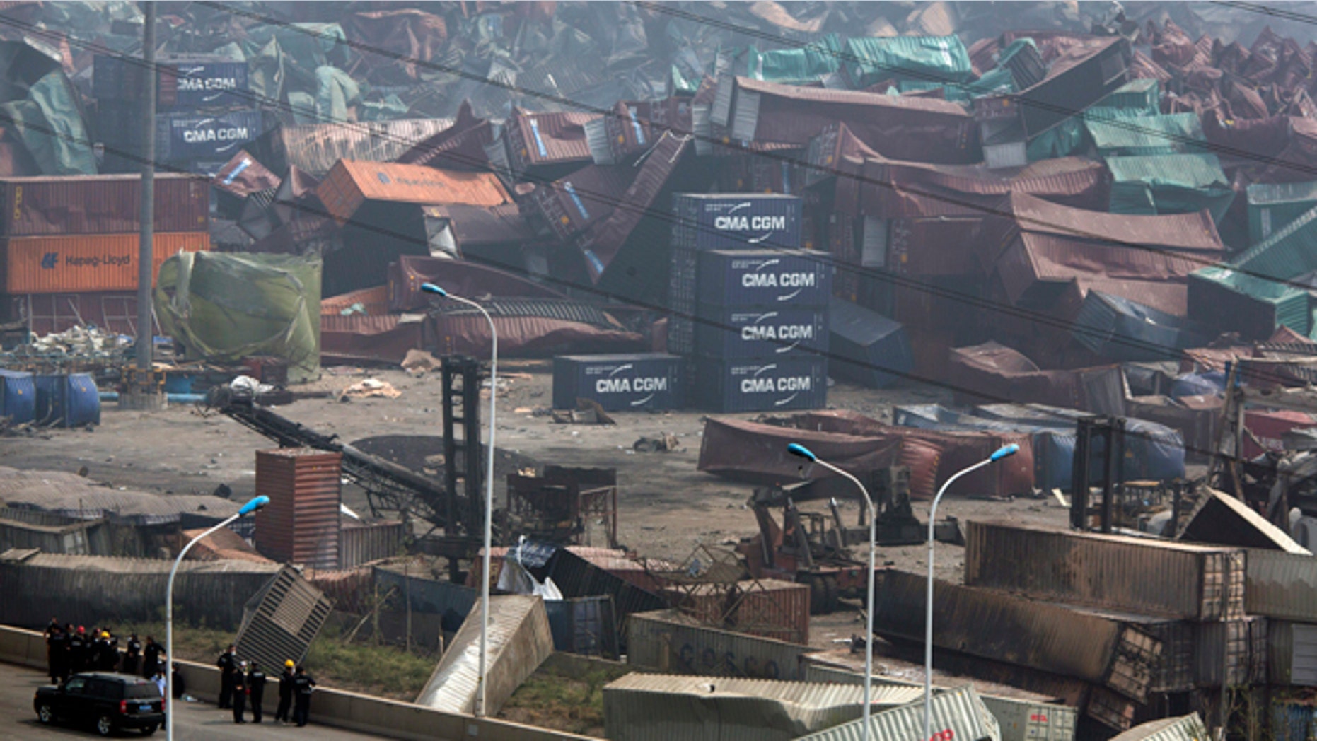 Aug. 15, 2015: Chinese emergency crew survey the site of an explosion in northeastern China's Tianjin municipality. New explosions and fire rocked the Chinese port city of Tianjin on Saturday, where one survivor was pulled out and authorities ordered evacuations within a 1.8-mile radius to clean up chemical contamination.