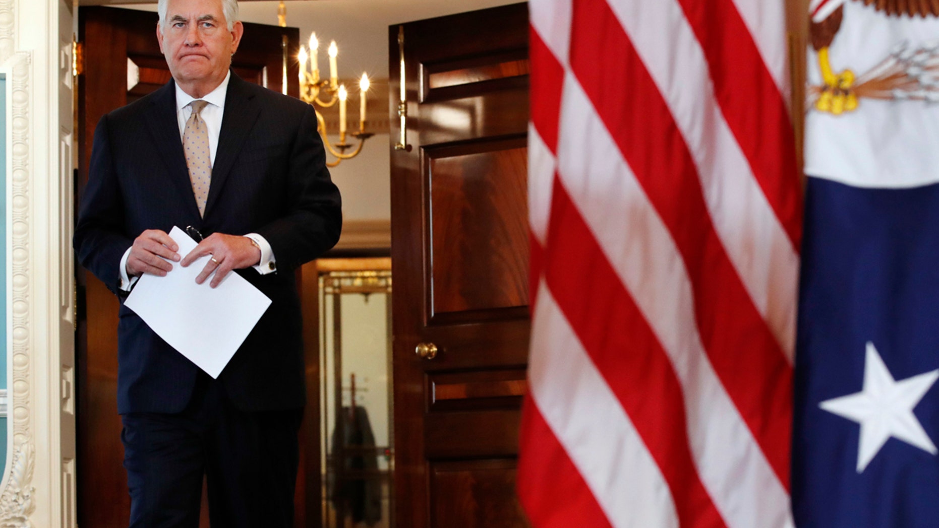 Secretary of State Rex Tillerson walks in to a news conference to speak about Qatar at the State Department in Washington, Friday June 9, 2017. Tillerson is calling on Saudi Arabia, Egypt, the United Arab Emirates and Bahrain to immediately ease their blockade on Qatar. (AP Photo/Jacquelyn Martin)