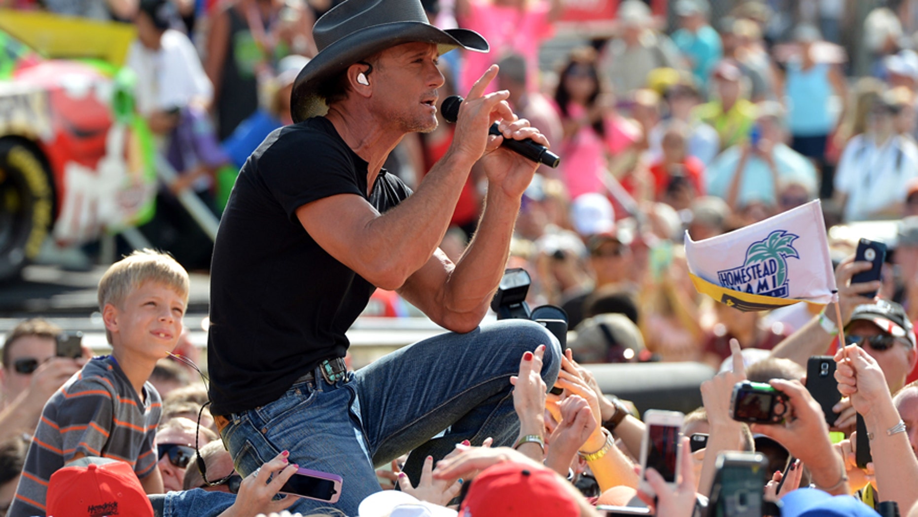 Nov 22, 2015; Homestead, FL, USA; Recording artist Tim McGraw performs prior to the Ford EcoBoost 400 at Homestead-Miami Speedway.