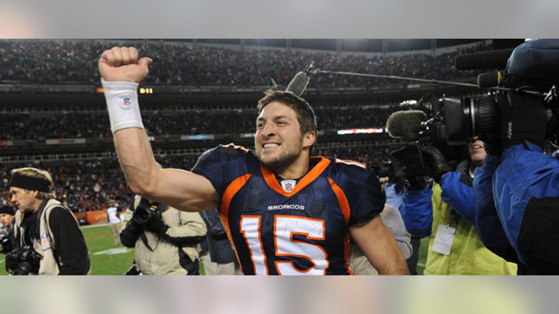Denver Broncos quarterback Tim Tebow (15) celebrates after beating the Pittsburgh Steelers 29-23 in overtime of an NFL wild card playoff football game Sunday, Jan. 8, 2012, in Denver. (AP Photo/Chris Schneider)