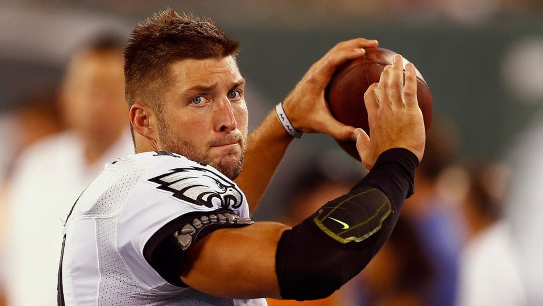 EAST RUTHERFORD, NJ - SEPTEMBER 03: Quarterback Tim Tebow #11 of the Philadelphia Eagles warms up on the sidelines against the New York Jets in the third quarter during a pre-season game at MetLife Stadium on September 3, 2015 in East Rutherford, New Jersey. (Photo by Rich Schultz /Getty Images)