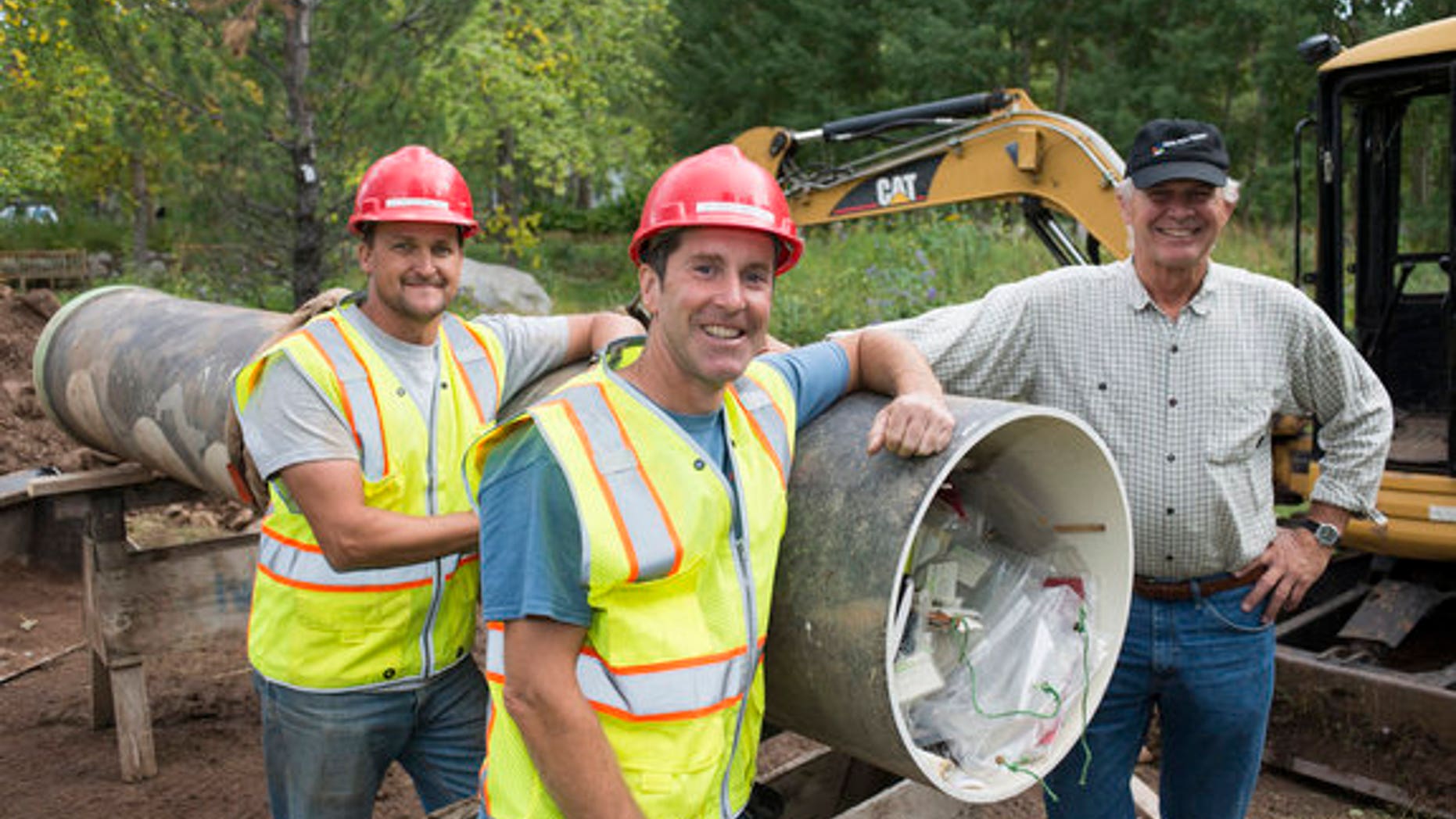 The Diggers team with the rediscovered time capsule from 1983.