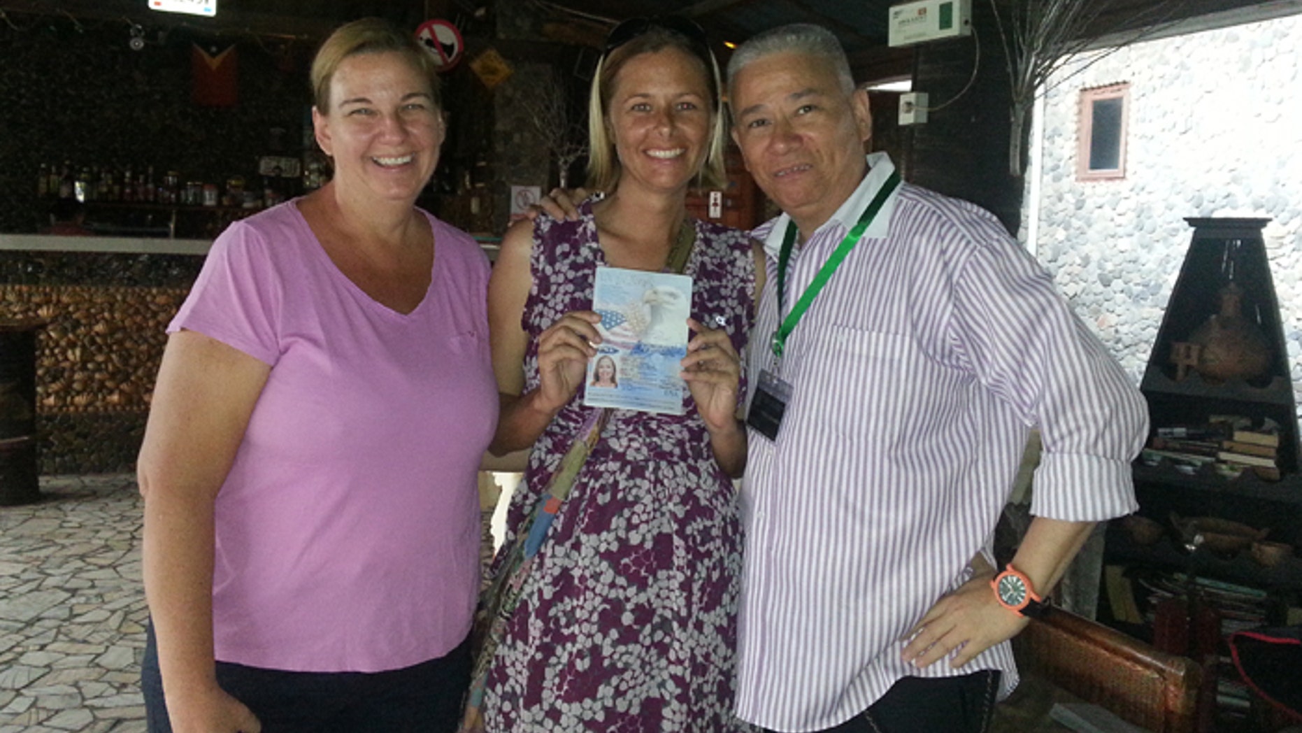Stacey Addison with her lawyer, Paul Ramedios, and an unidentified adviser from the US Embassy.