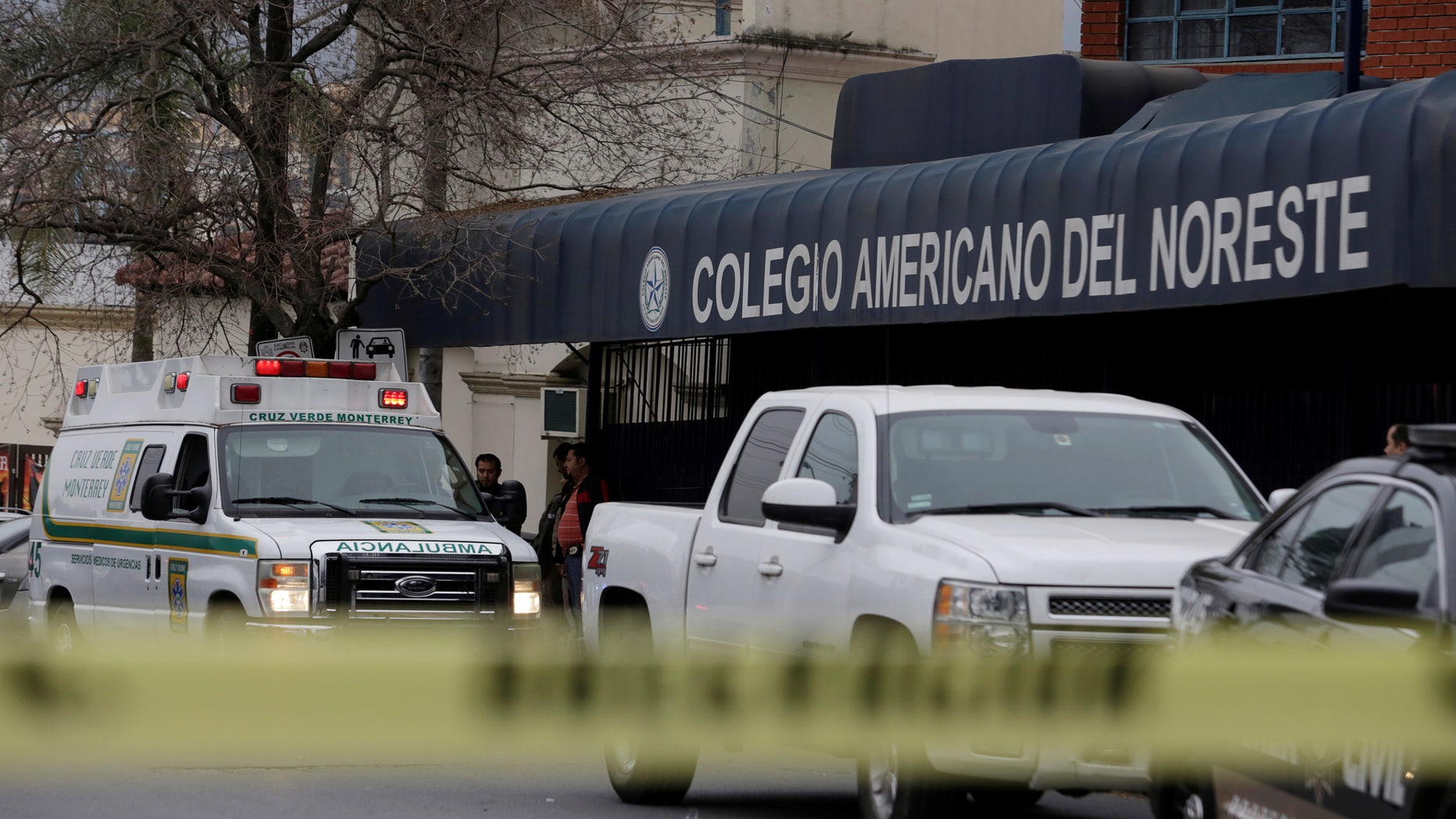 A yellow police line cordons off access to the Colegio Americano del Noreste after a student opened fire.