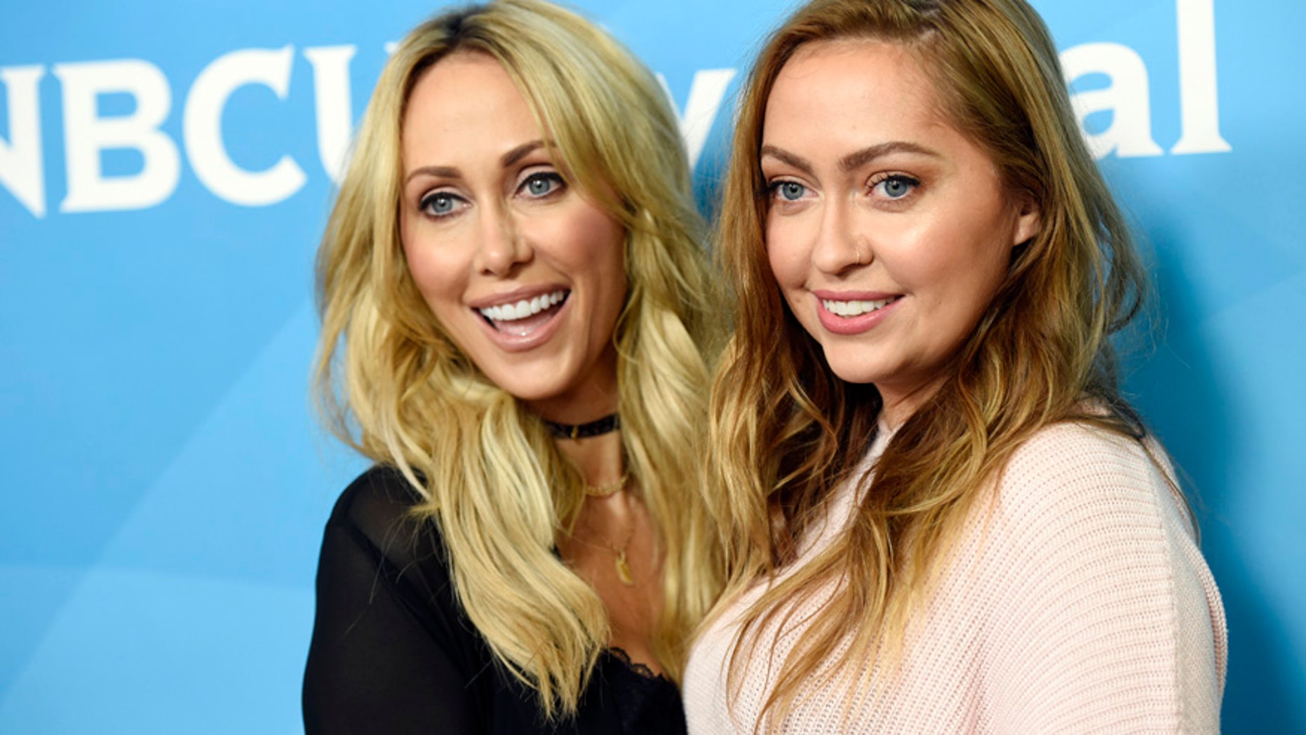 Tish Cyrus, left, and her daughter Brandi, cast members in the Bravo series "Cyrus vs. Cyrus: Design & Concur," pose together at the 2017 NBCUniversal Summer Press Day at the Beverly Hilton on Monday, March 20, 2017, in Beverly Hills, Calif. (Photo by Chris Pizzello/Invision/AP)