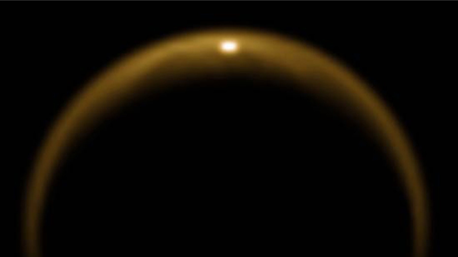 This image, obtained using Cassini's Visual and Infrared Mapping Spectrometer (VIMS), shows the first observed flash of sunlight reflected off a lake on Saturn's moon Titan.