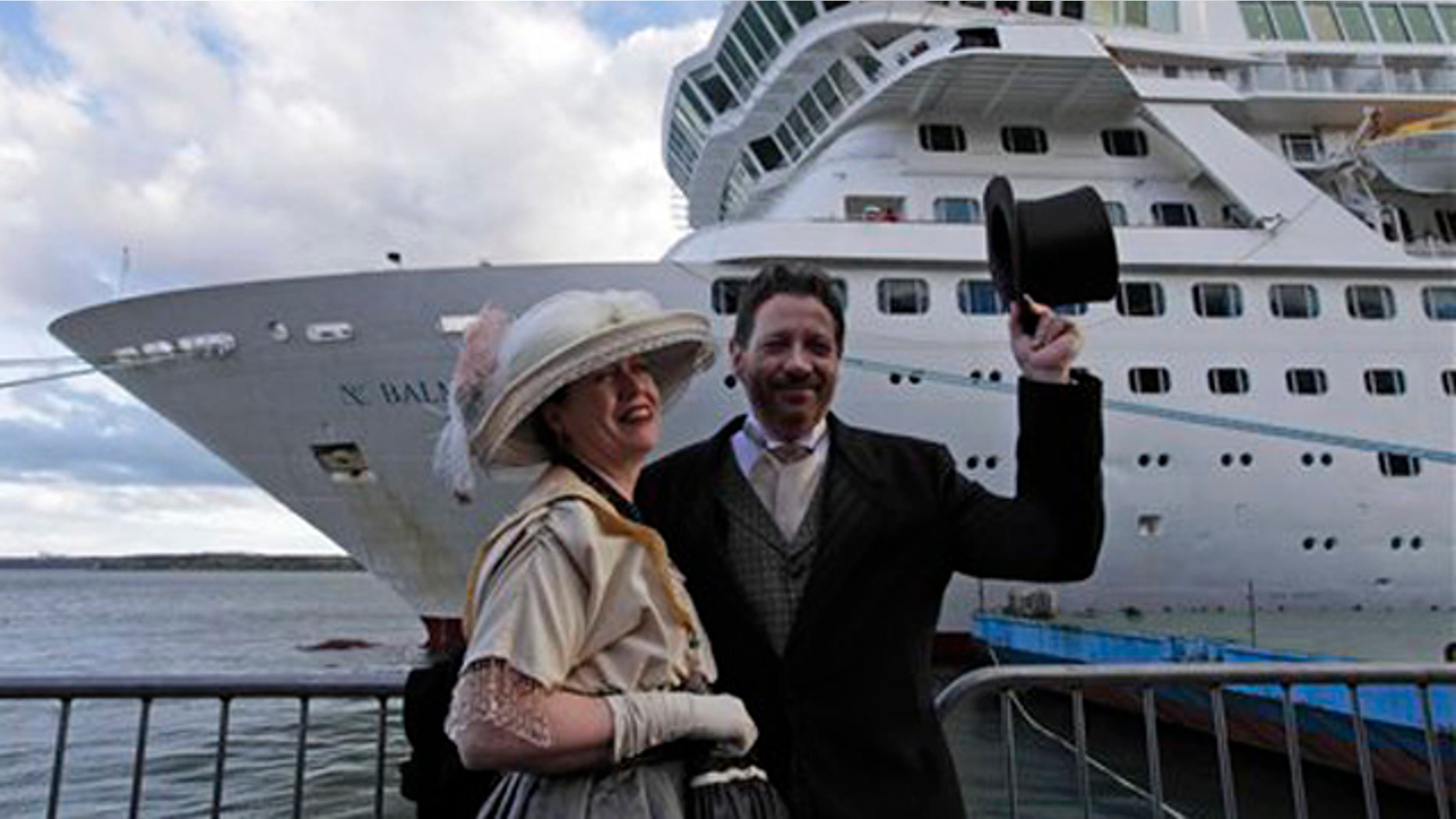 April 9, 2012: Mary Beth Crocker, left, and her husband Tom Dearing from Newport Ky. pose for pictures in period costume as they disembark the MS Balmoral Titanic memorial cruise ship at its first stop in Cobh, Ireland.