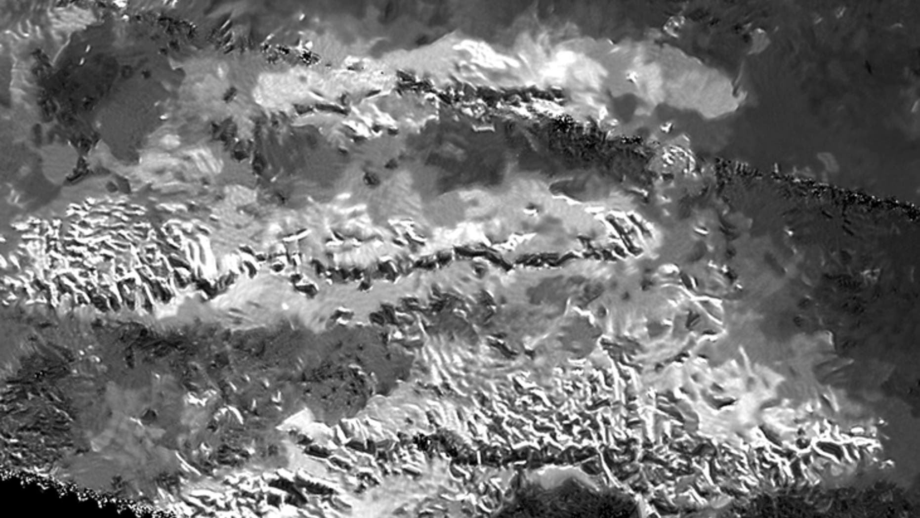 The trio of ridges on Titan known as Mithrim Montes is home to the hazy Saturnian moon's tallest peak. (NASA/JPL-Caltech/ASI)