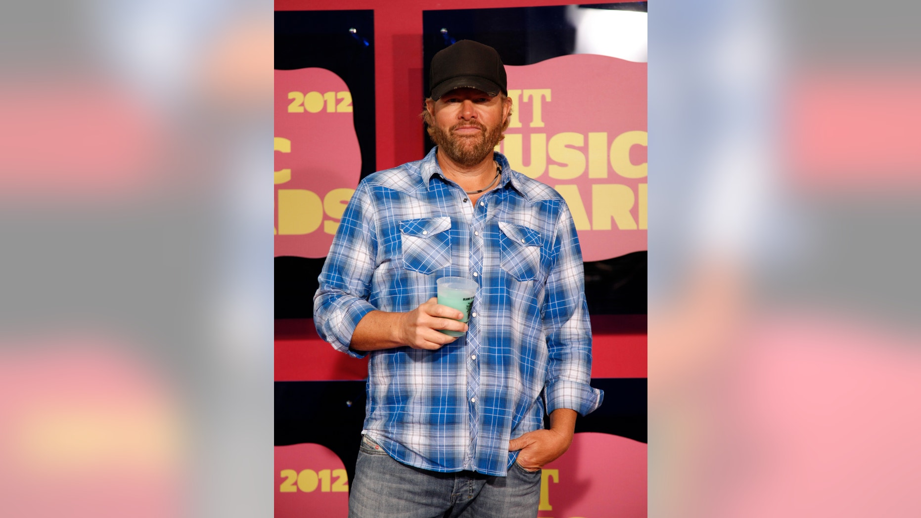 Host and singer Toby Keith arrives at the 2012 CMT Music Awards in Nashville, Tennessee June 6, 2012